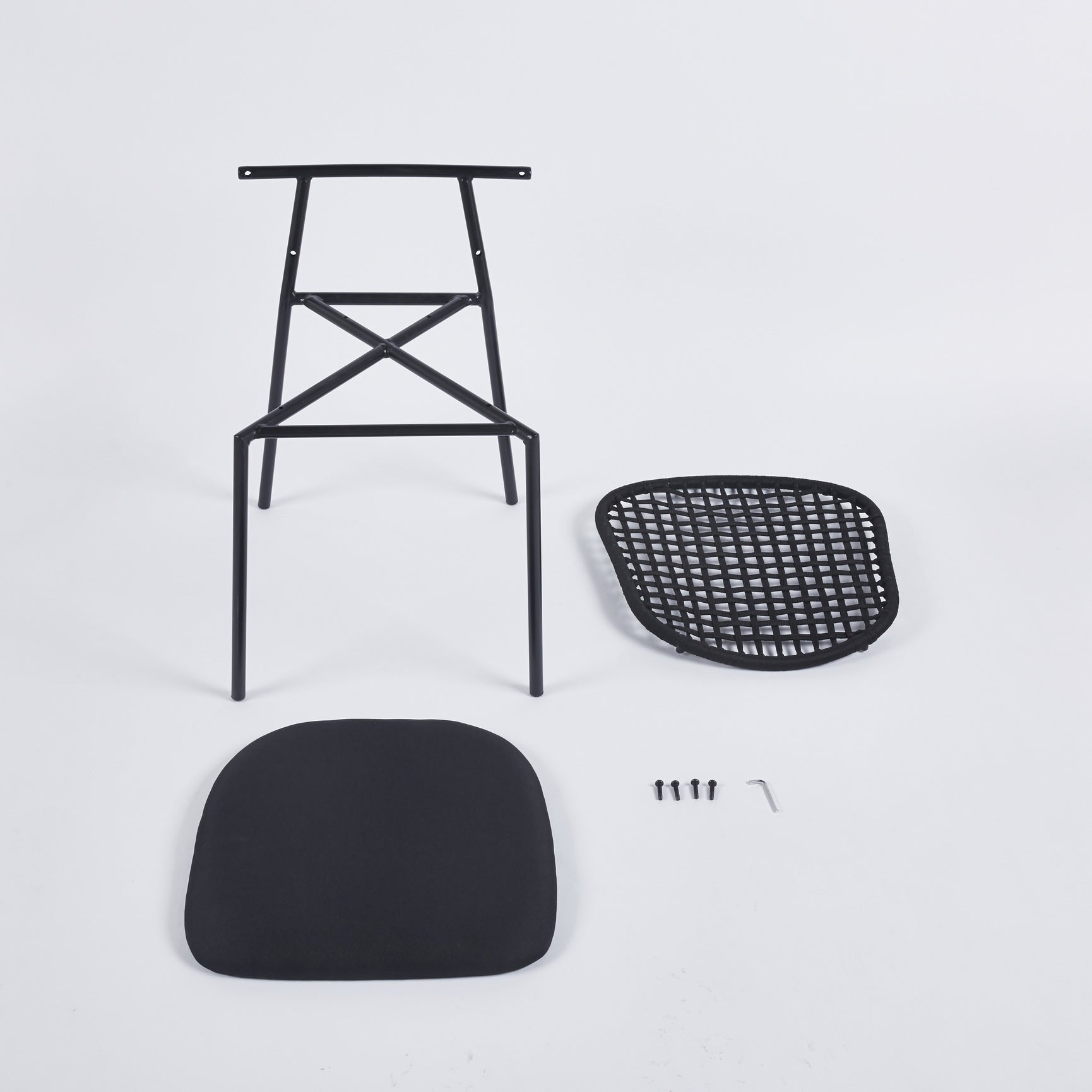Black metal chair frame with separate cushion and seat for assembly