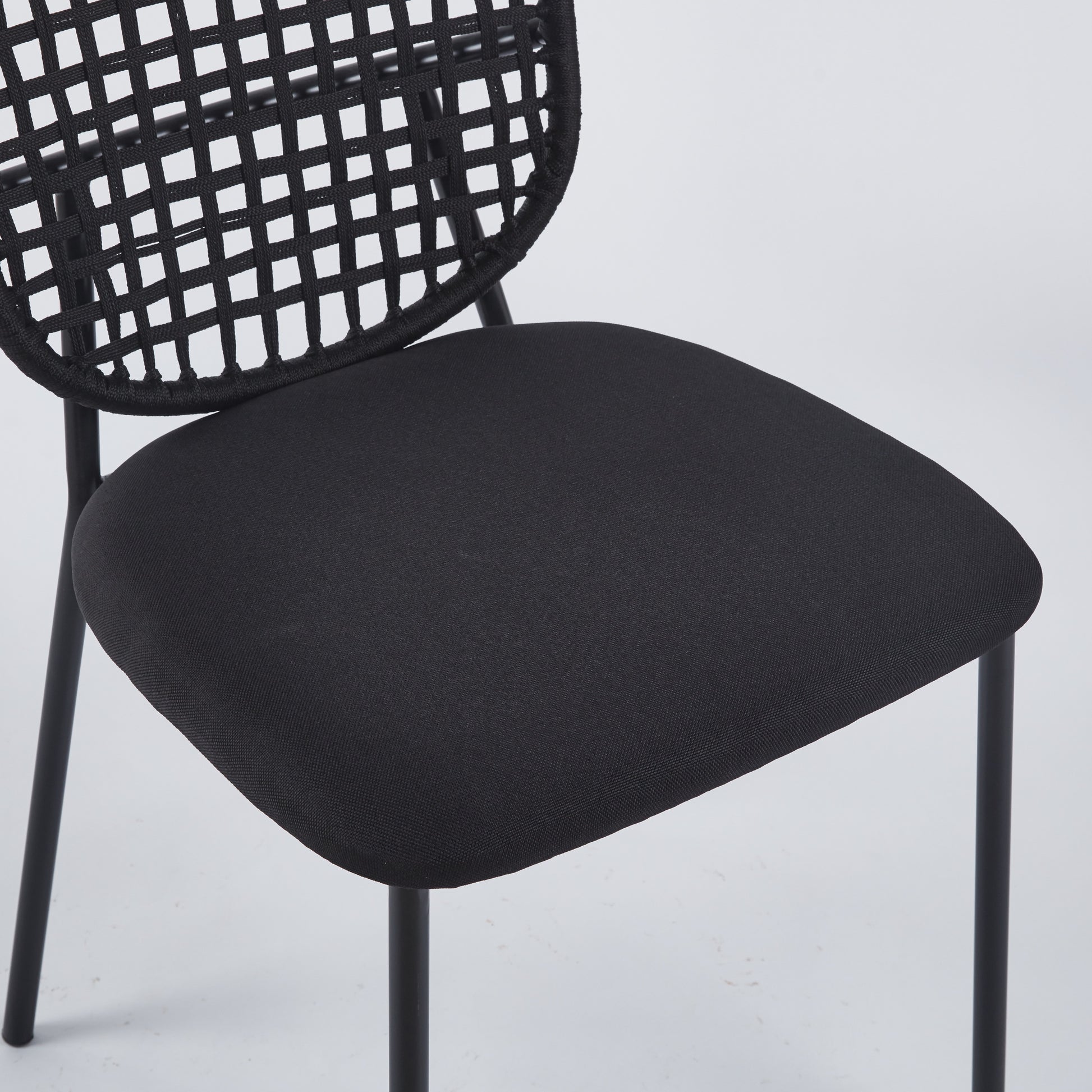 Black upholstered seat modern dining chair with woven back