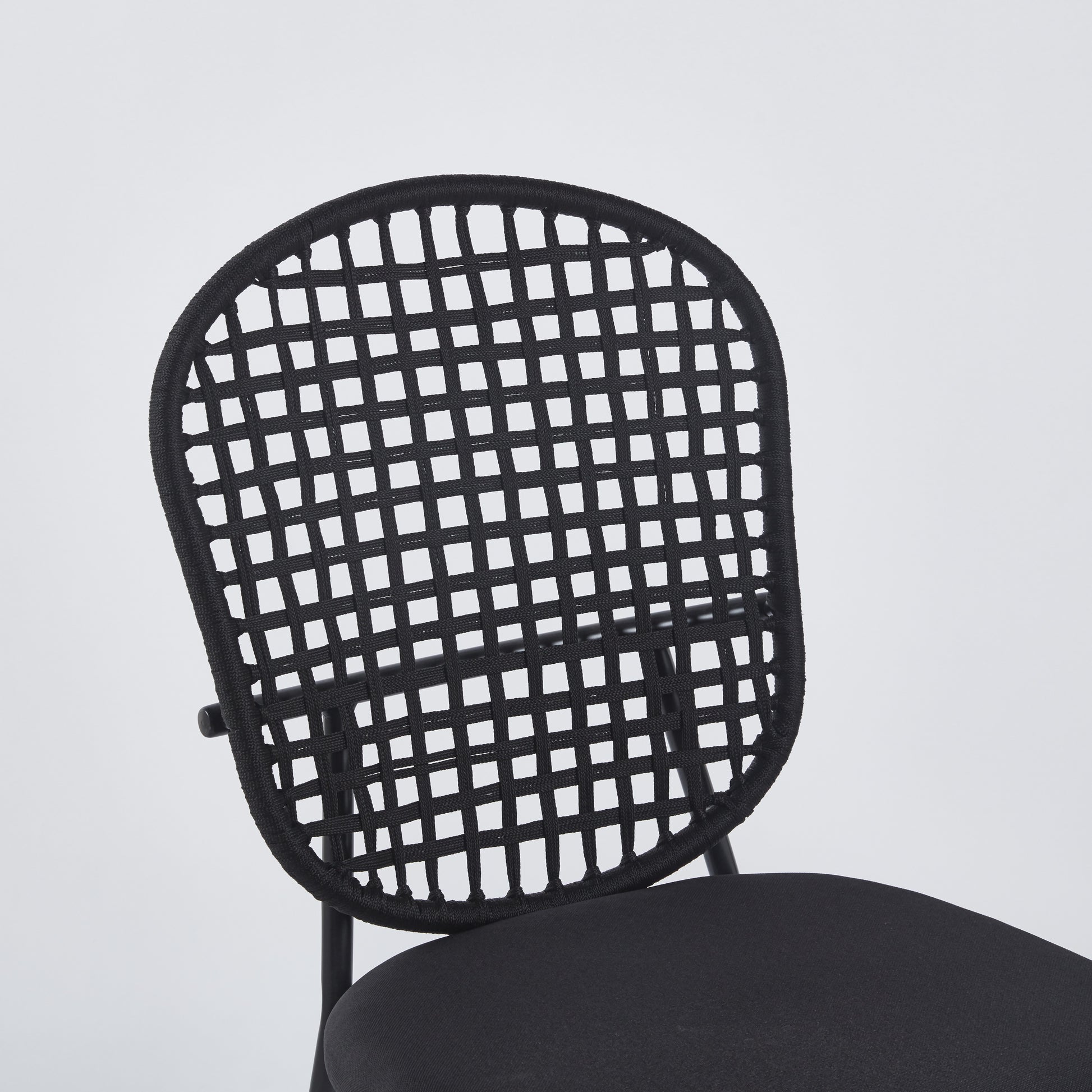 Black woven cord chair back with upholstered seat modern design for comfortable seating