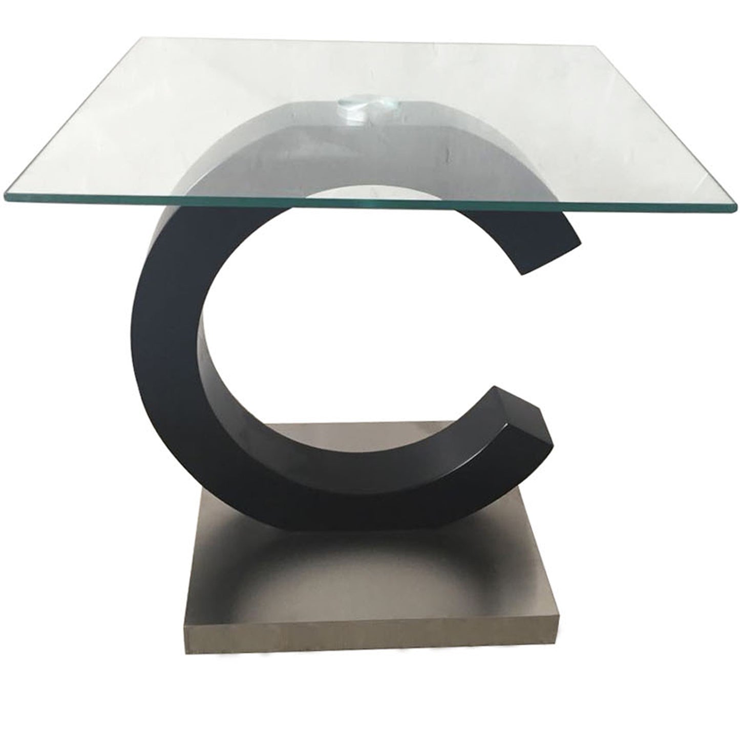 Modern accent table with clear glass top and matte black Cshaped base
