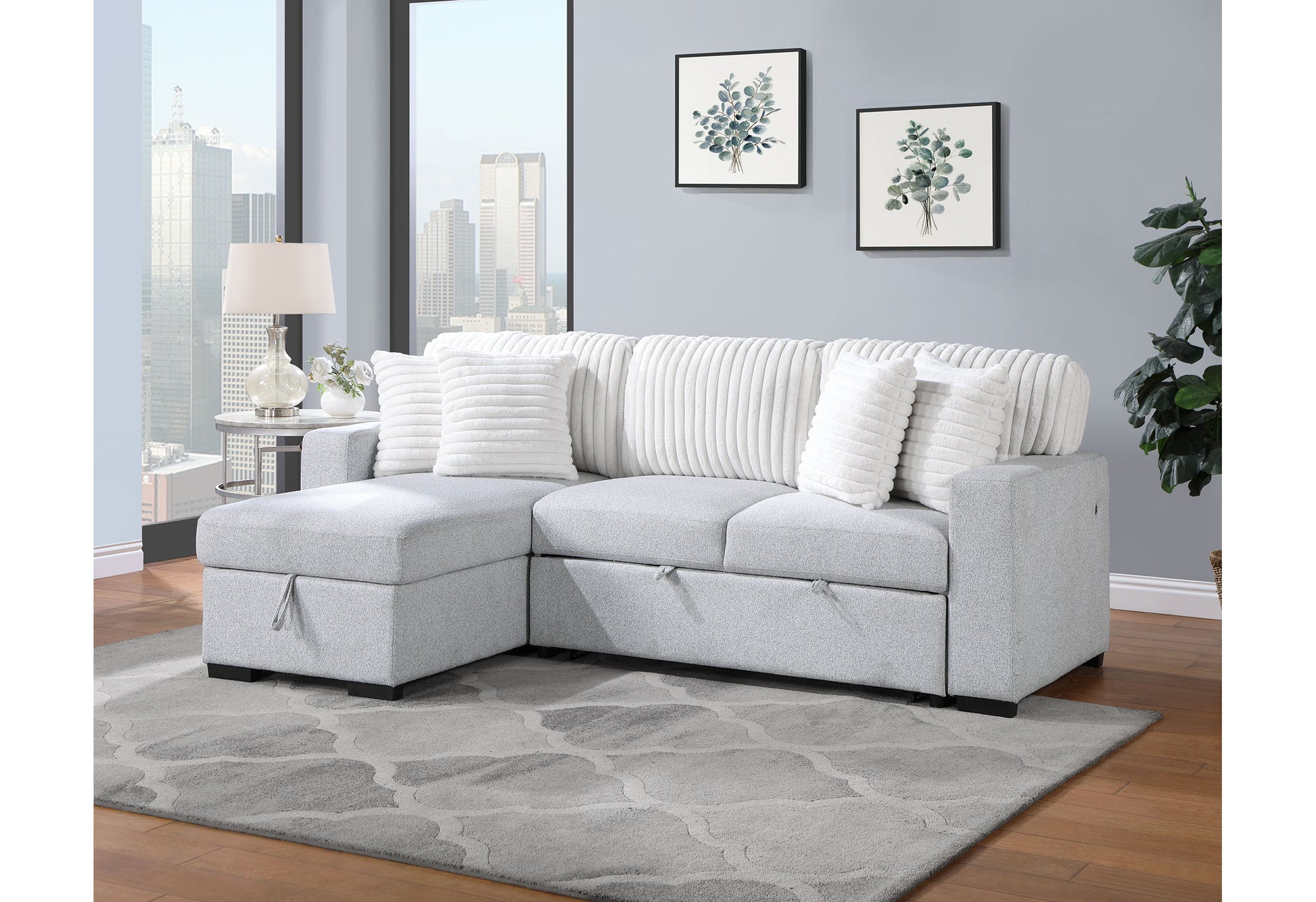 Light gray sectional sofa with chaise featuring textured fabric and plush white pillows