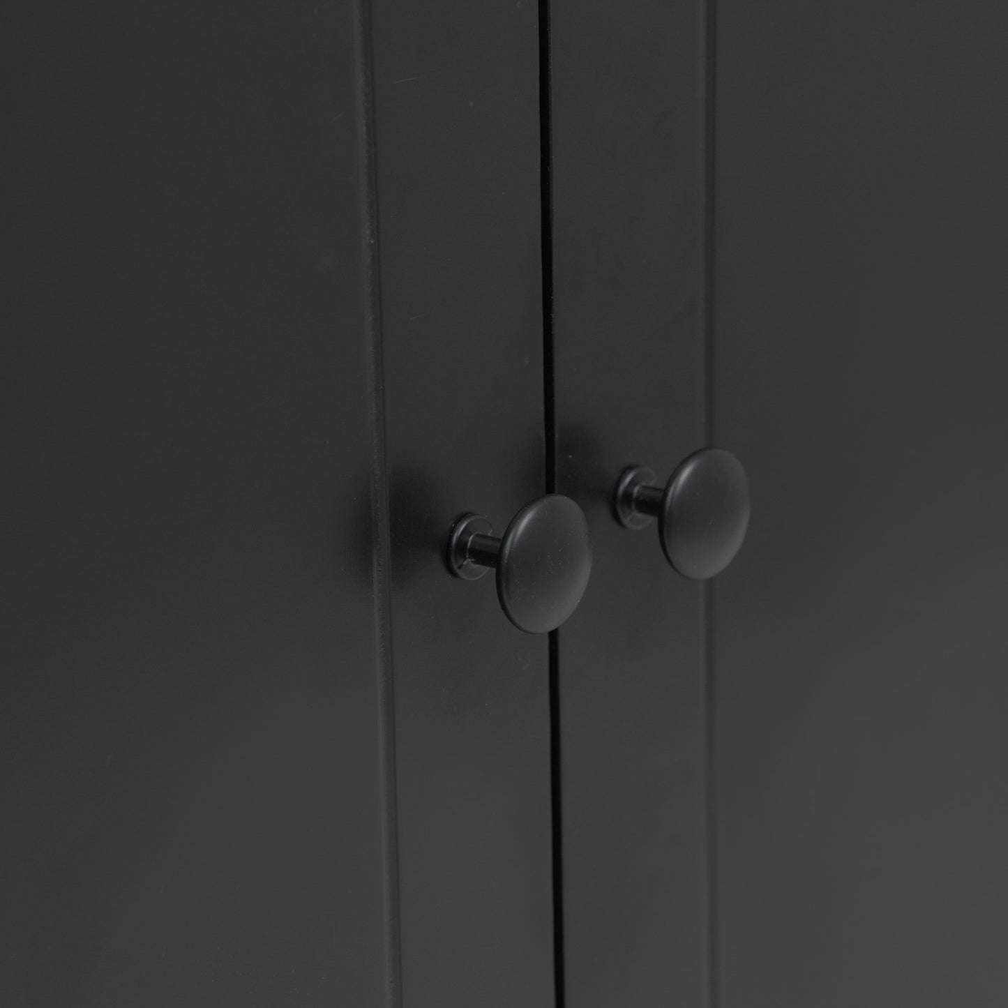 Black modern cabinet with two round black knobs