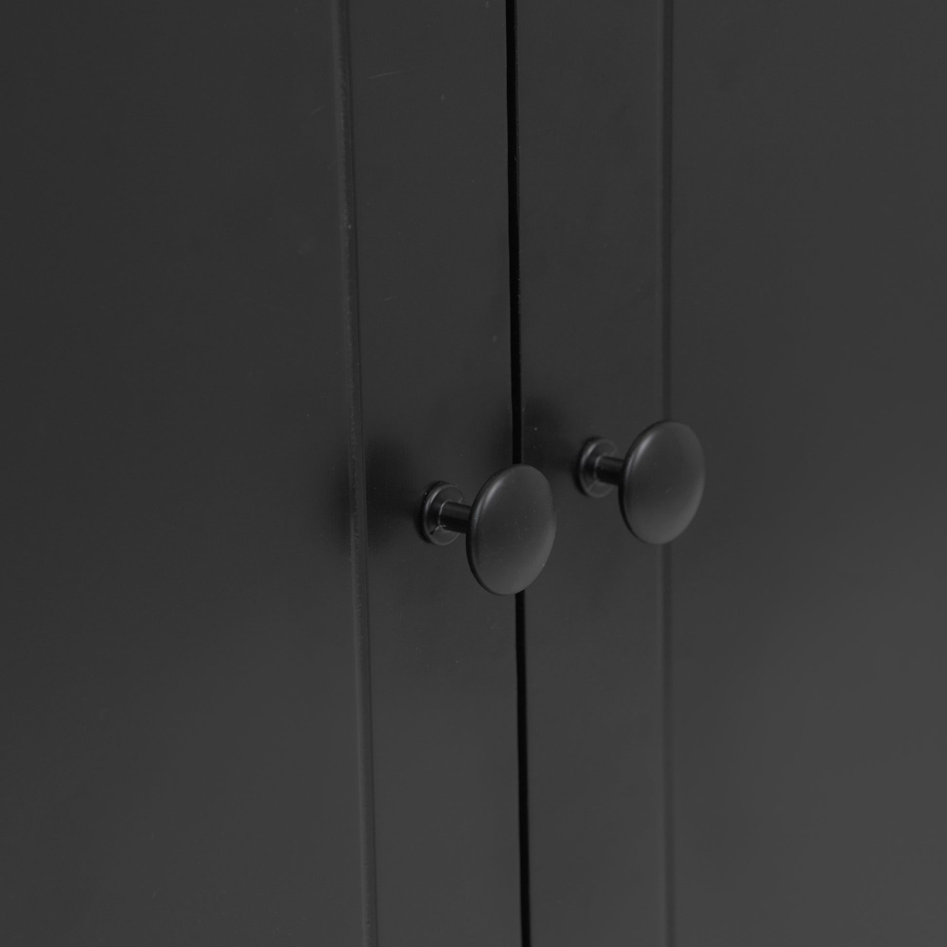 Black modern cabinet with two round black knobs