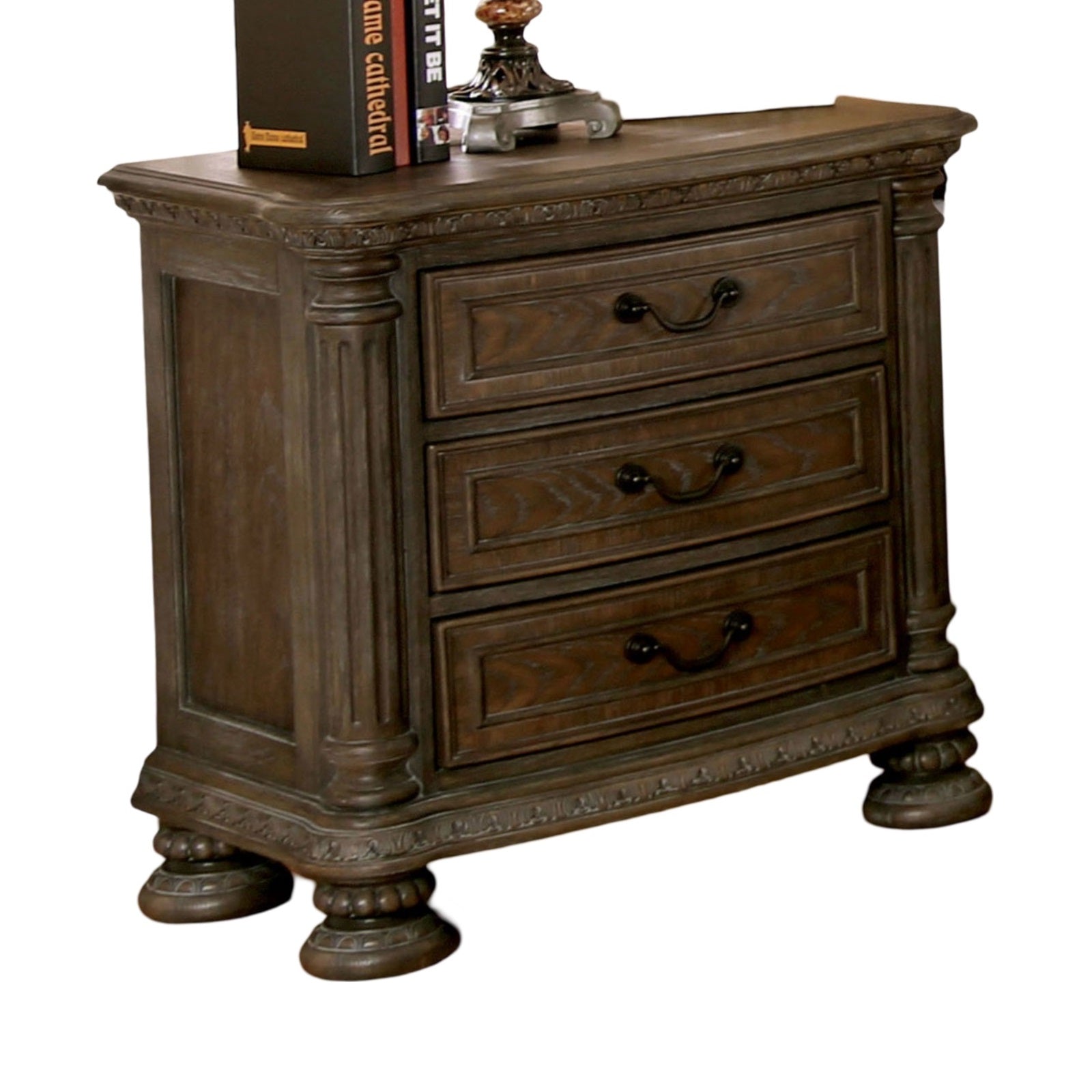 Dark oak carved wood nightstand with three drawers and ornate metal handles