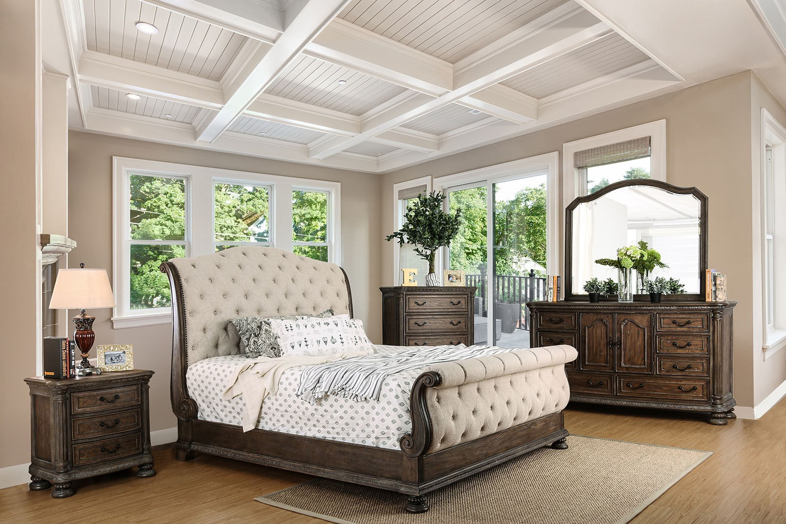 Tufted beige fabric sleigh bed with dark wood frame and carved details for a luxurious bedroom