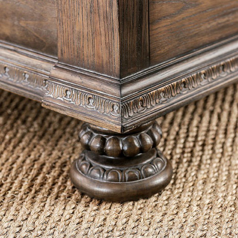 Ornate wooden furniture leg with carved detailing