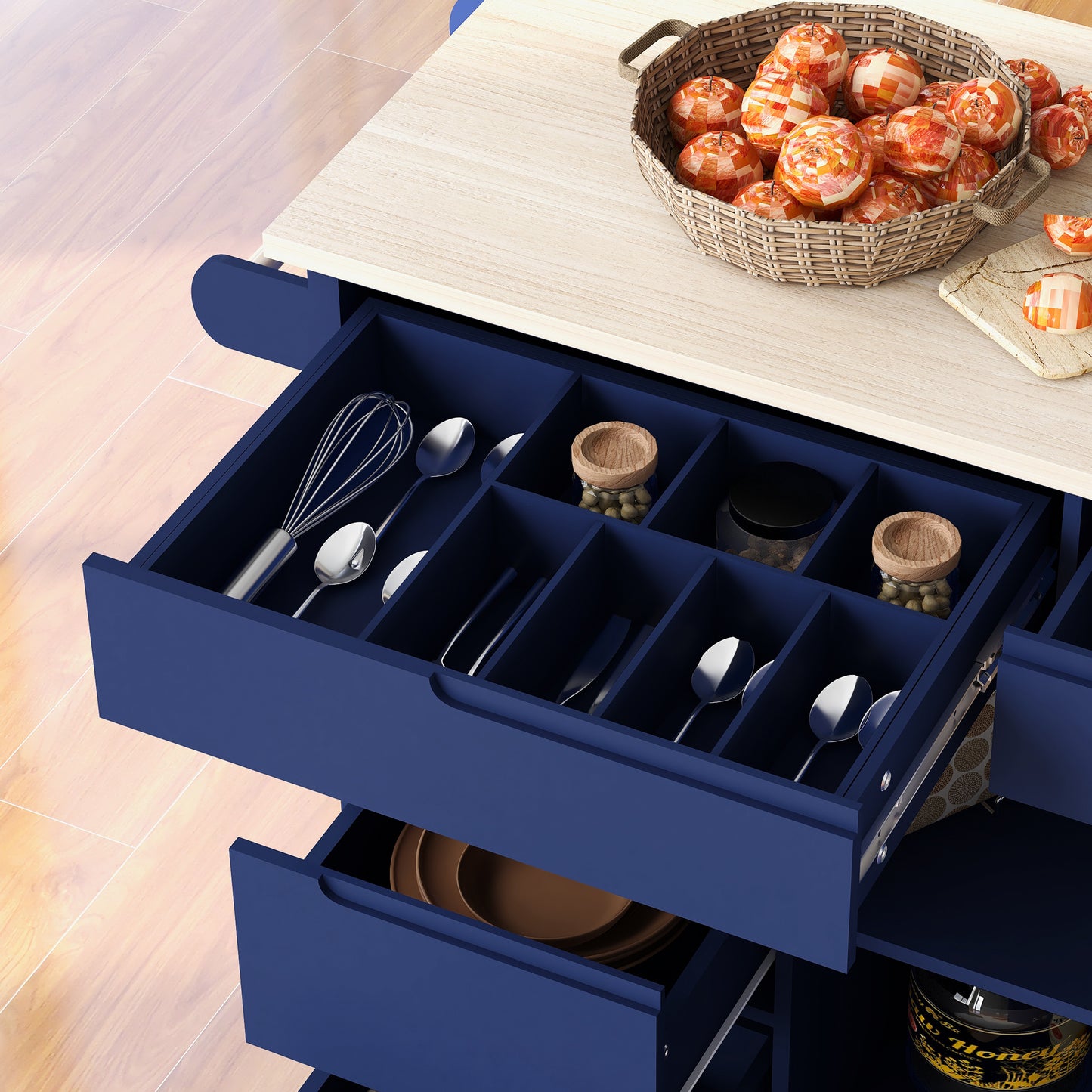 Blue kitchen island with organized drawers filled with utensils and fruits