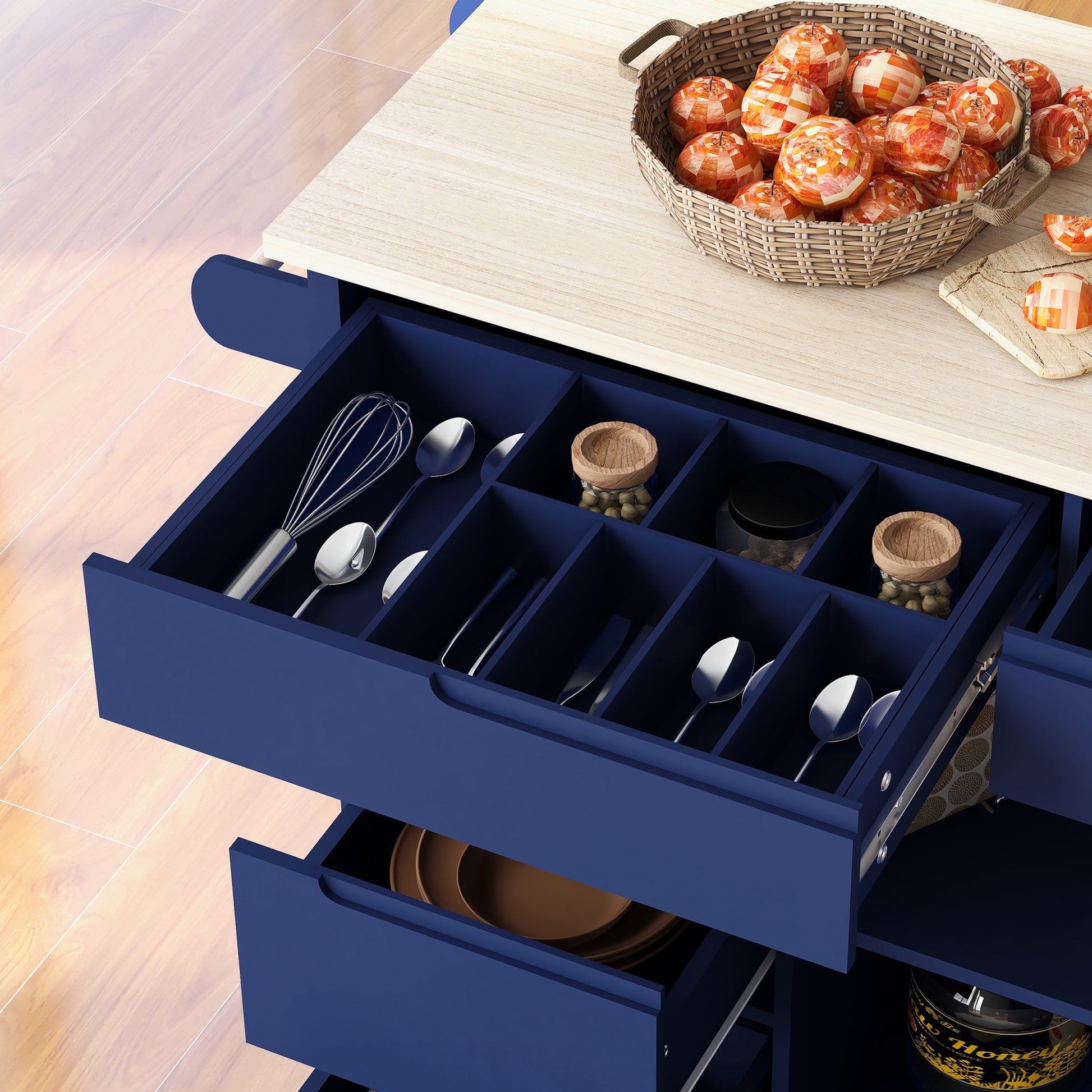Blue kitchen island with organized drawers filled with utensils and fruits