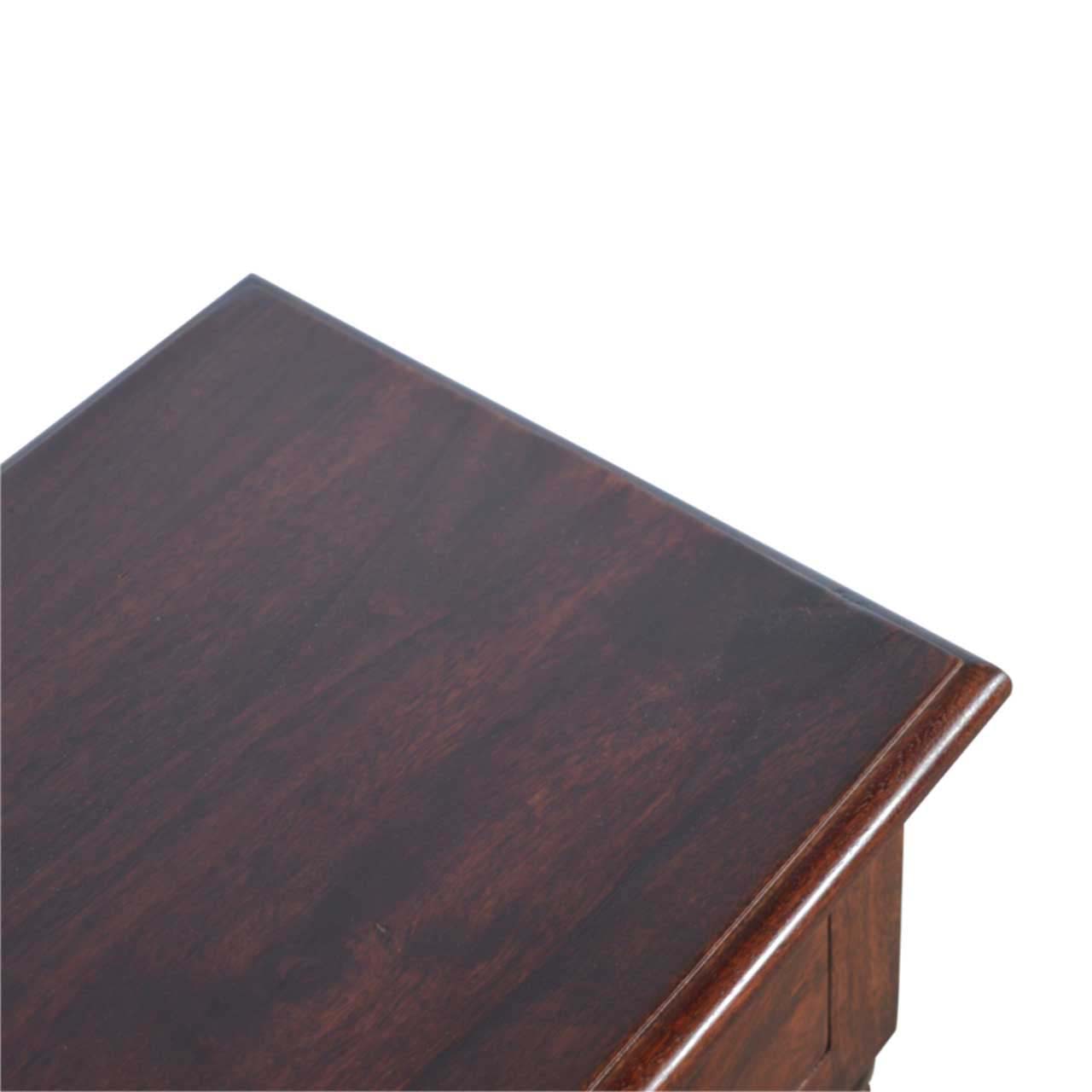 Rich dark wood antique desk surface with beveled edge detail