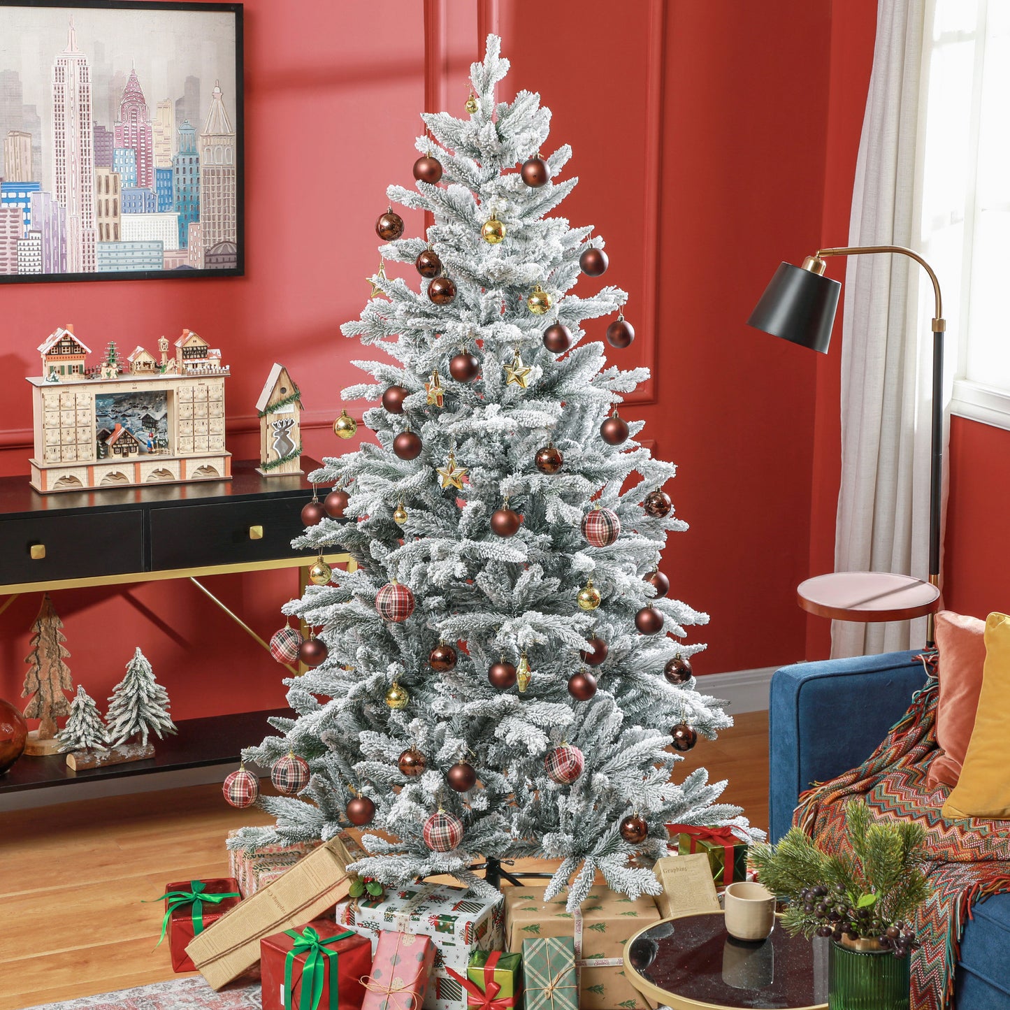 Flocked artificial Christmas tree with bronze and plaid ornaments gifts underneath