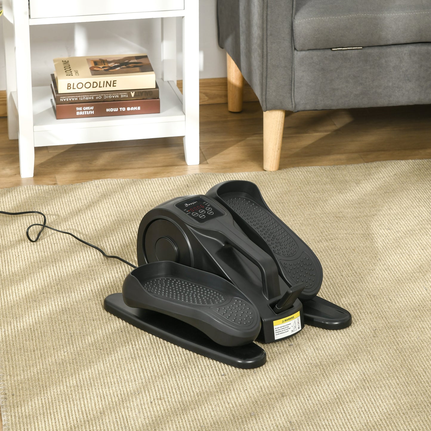 Compact black elliptical machine with digital display for home workouts