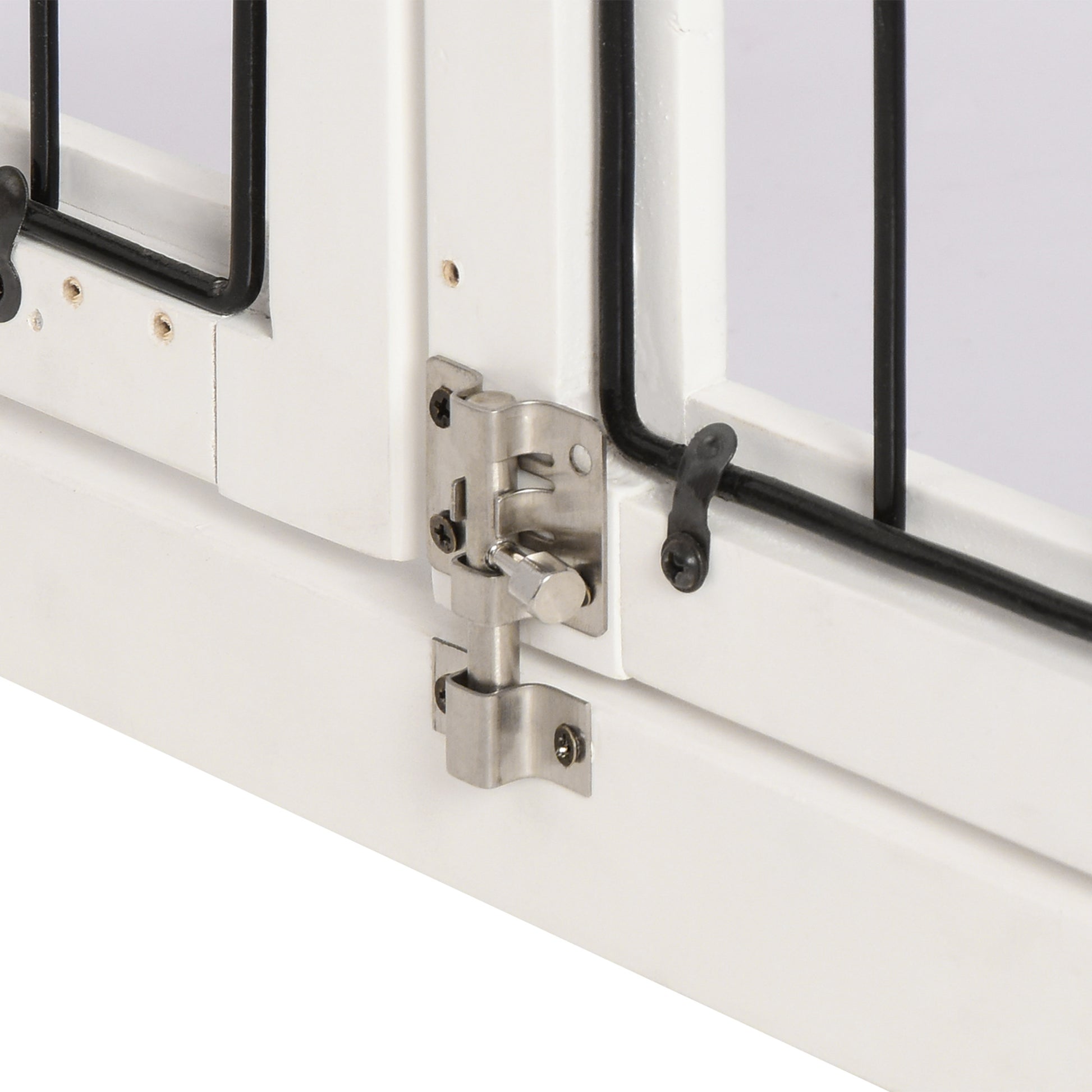 White wooden pet gate with silver bolt latch and black metal bars