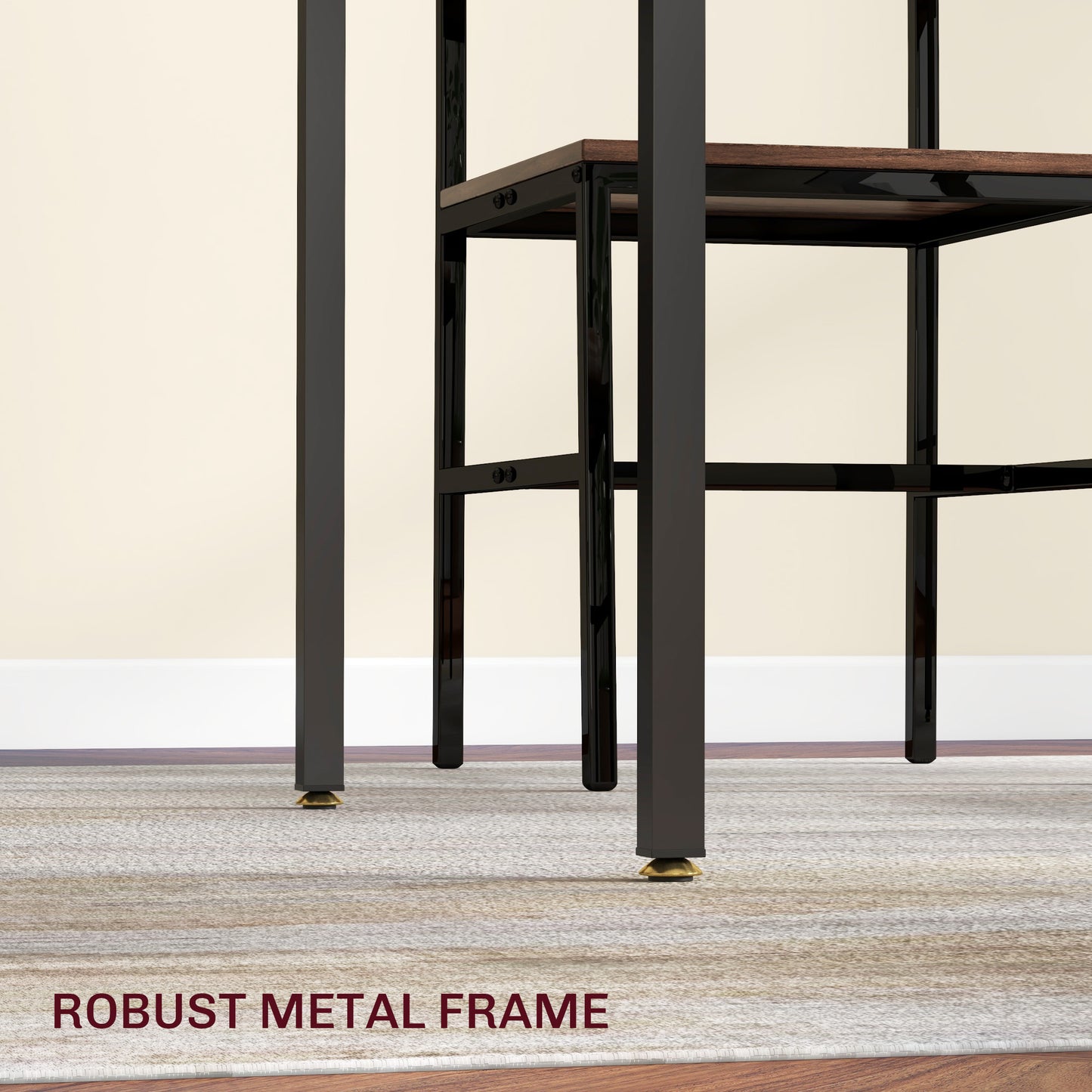 Closeup of a black metal desk frame with adjustable gold footings on a textured rug