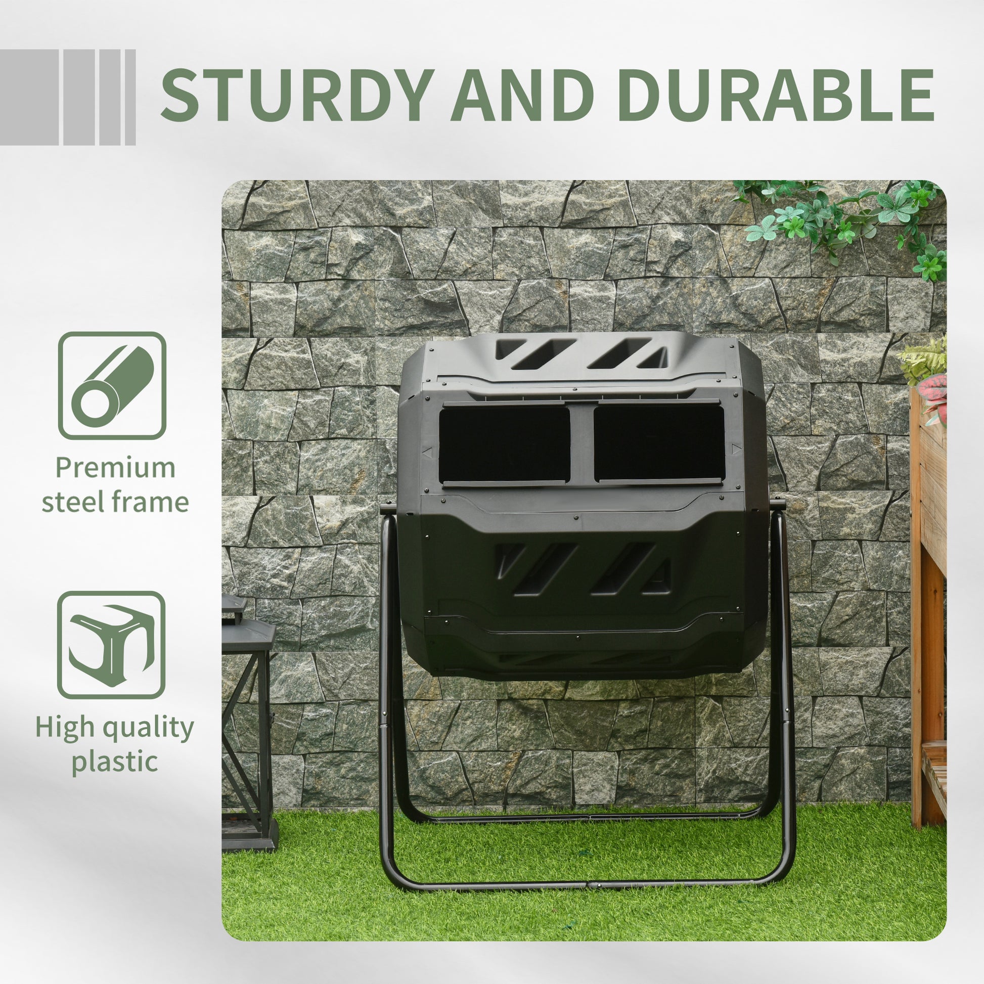 Black dualchamber tumbling composter with steel frame on green grass