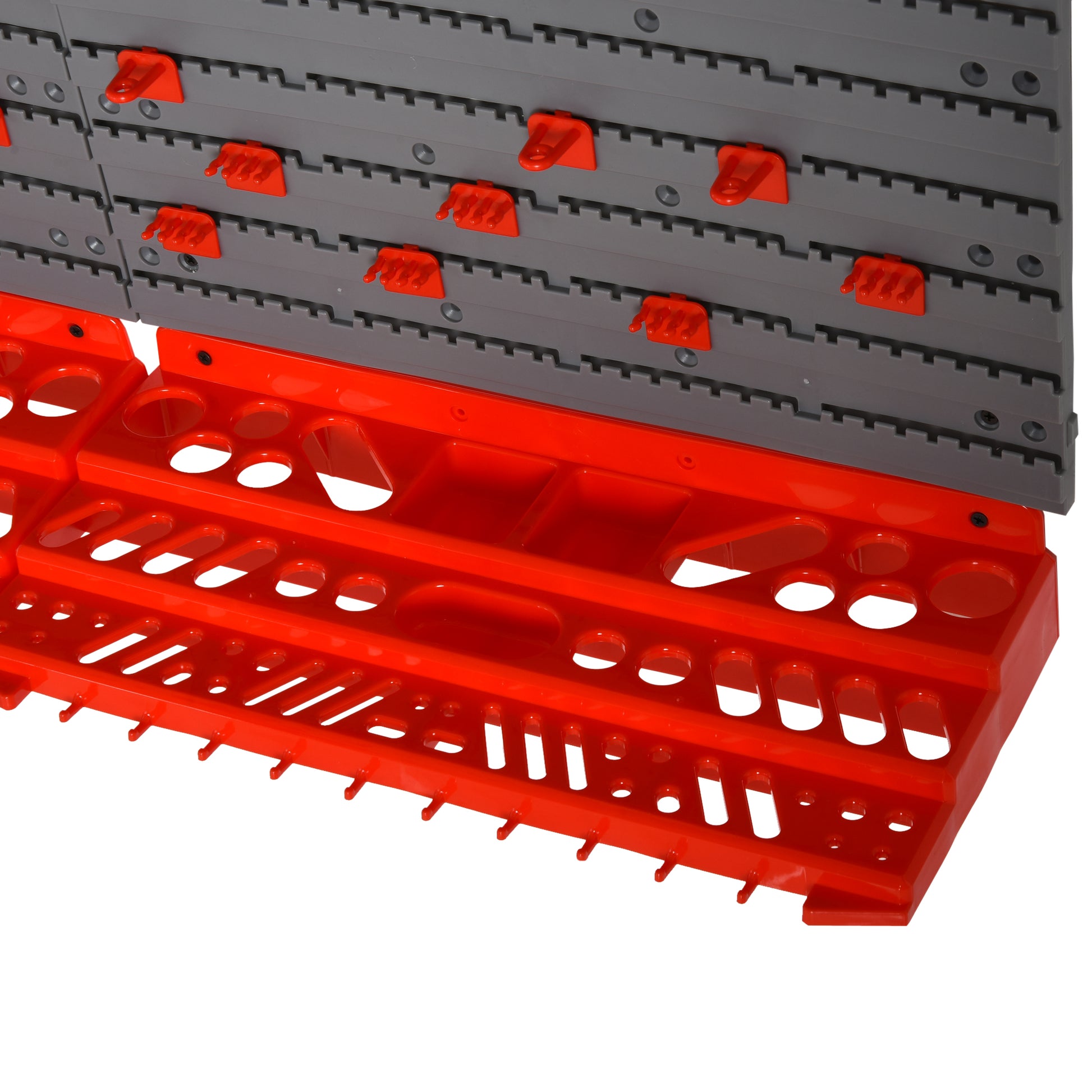 Modular grey pegboard system with orange tool holders and hooks