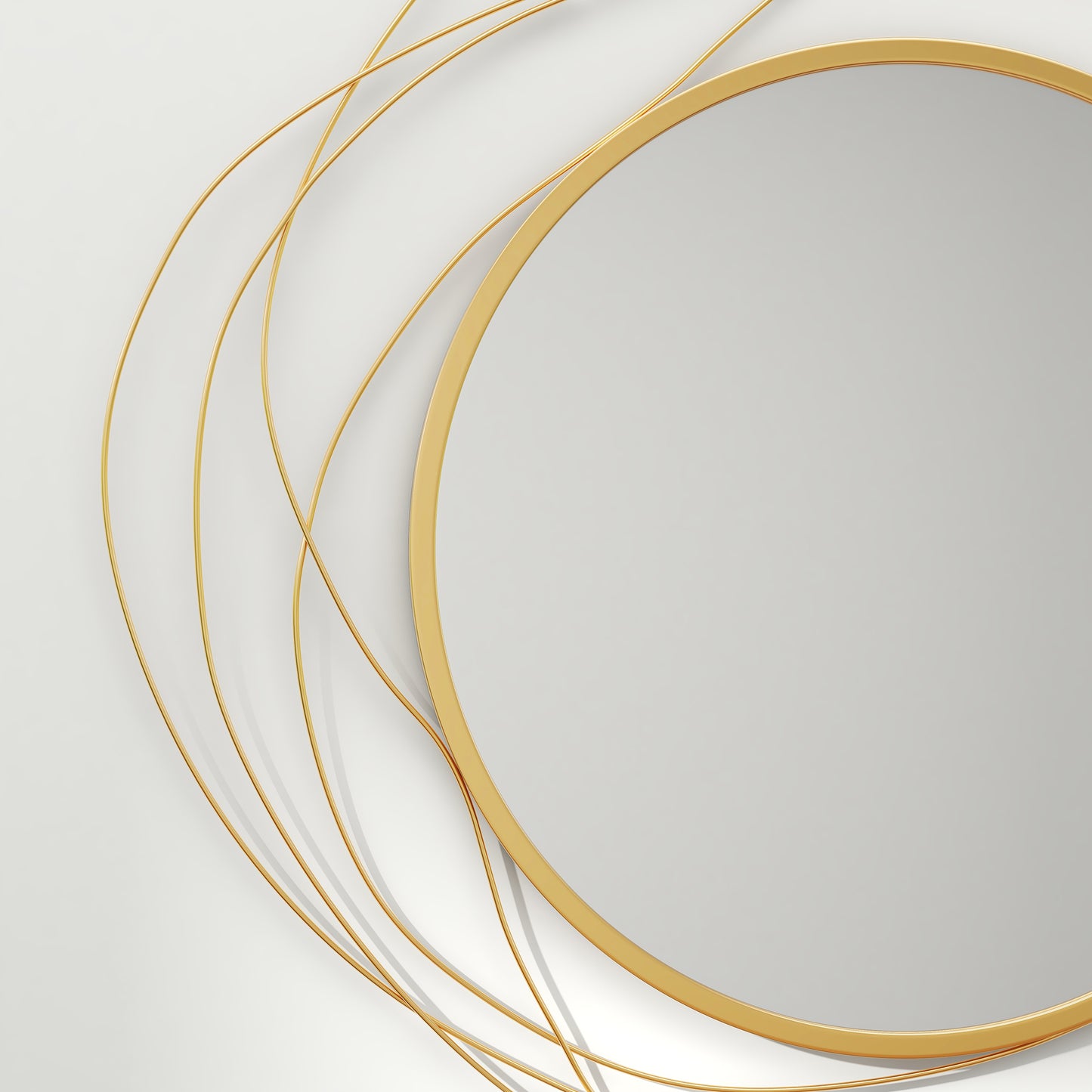 Circular gold frame mirror with abstract wire accents a modern decorative piece
