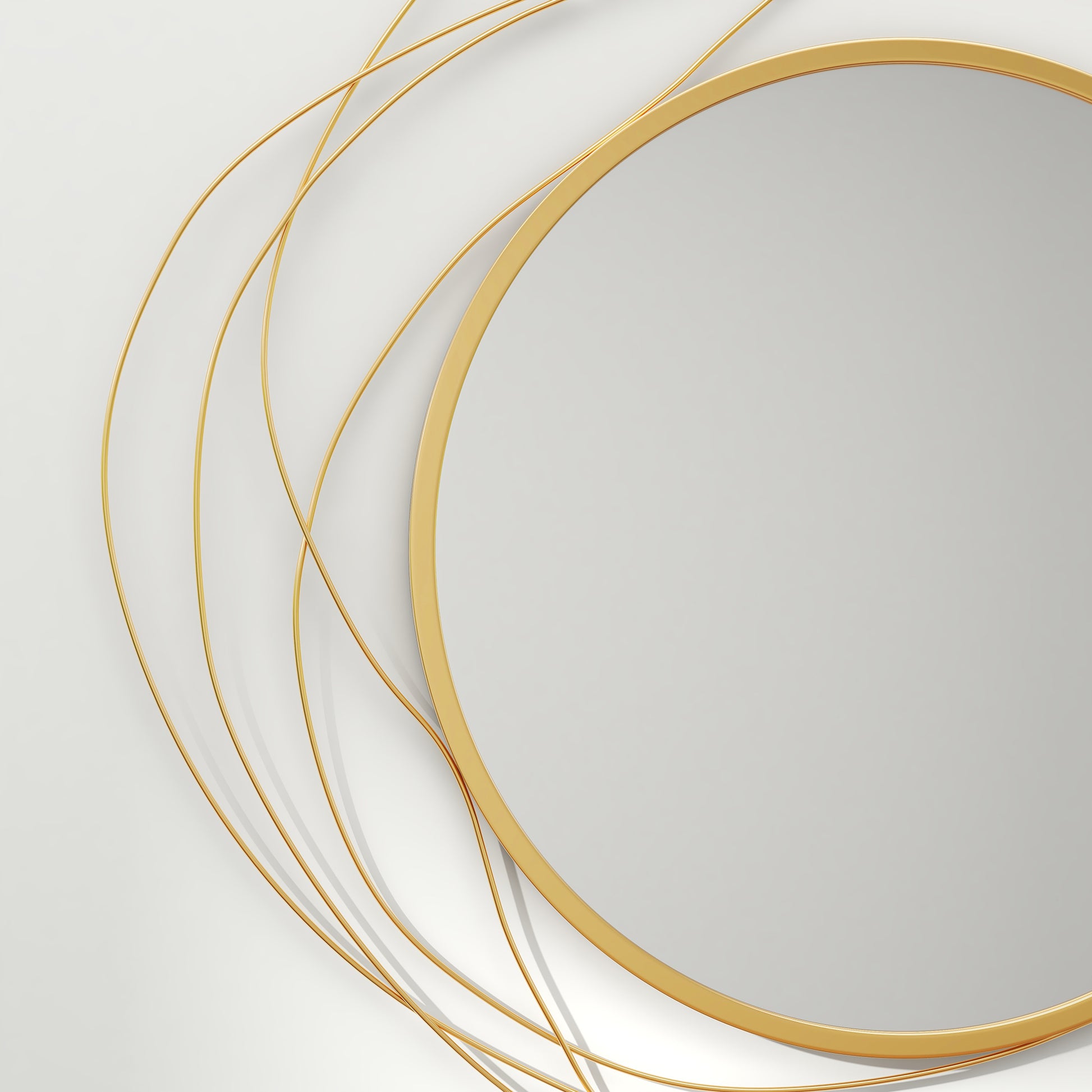Circular gold frame mirror with abstract wire accents a modern decorative piece