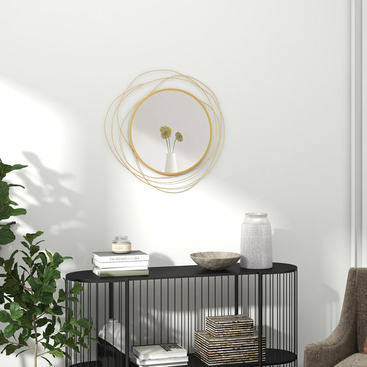 Abstract gold metal wall mirror with concentric circular design and a white vase with yellow flowers reflecting