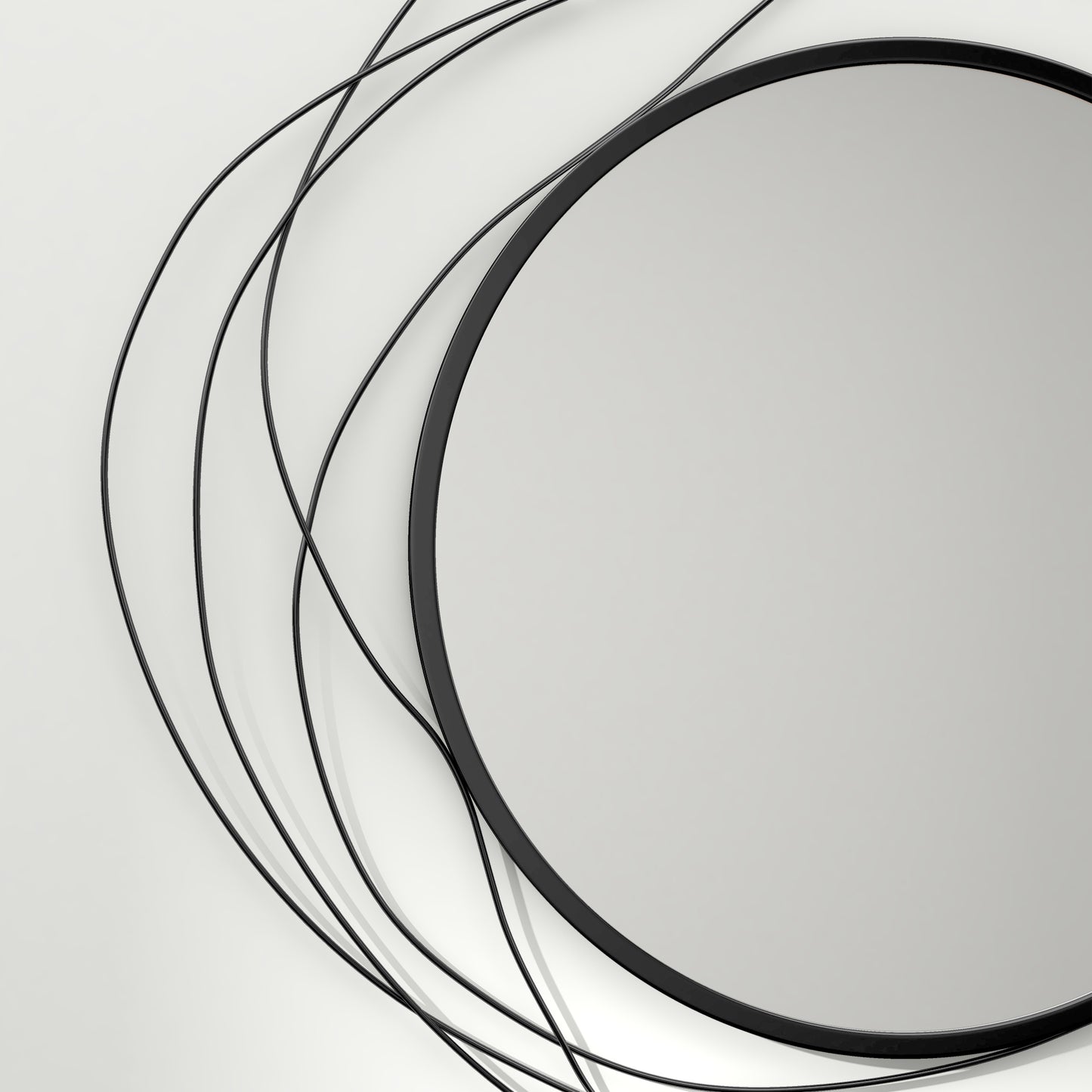 Round black metal abstract wall mirror with swirling wire accents
