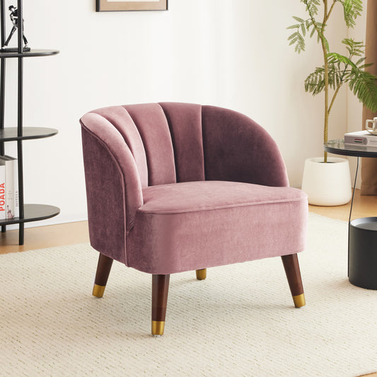 Dusty rose velvet armchair with channel tufting and goldcapped wooden legs