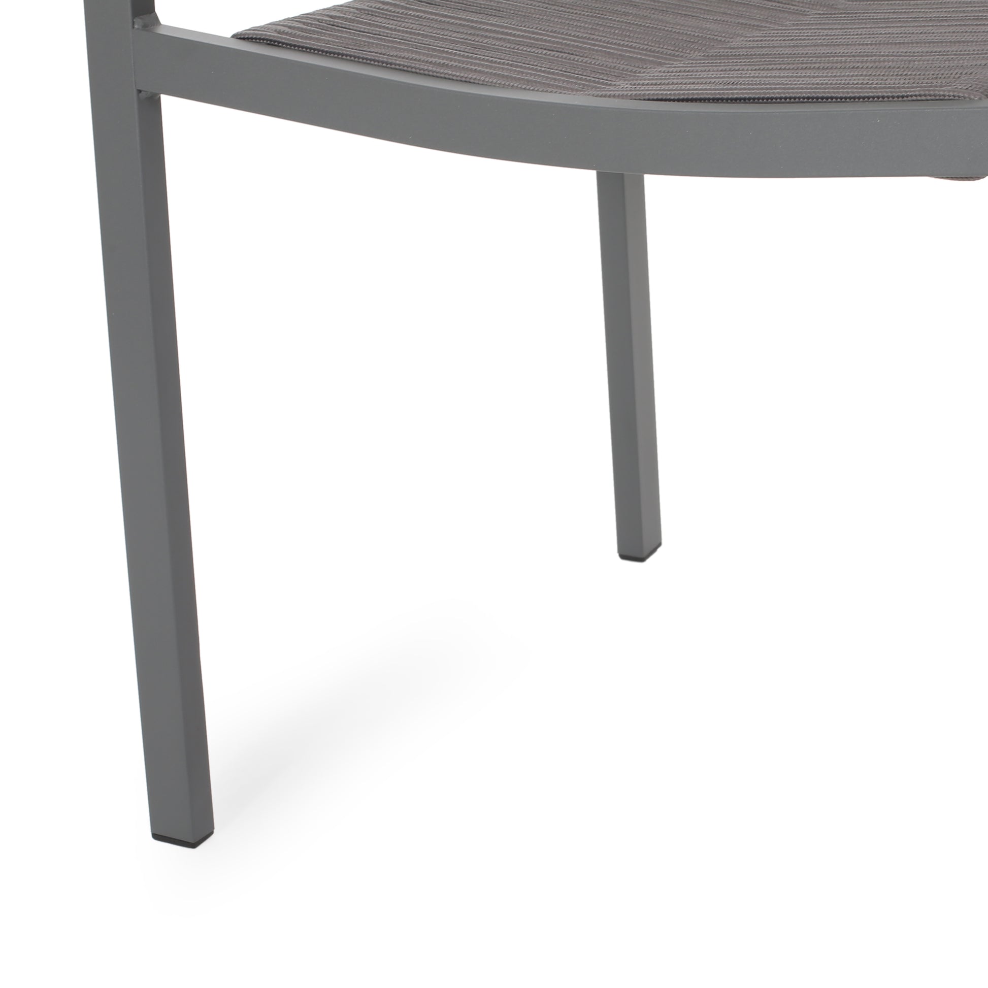 Closeup of a grey aluminum patio chair leg with woven seat detail
