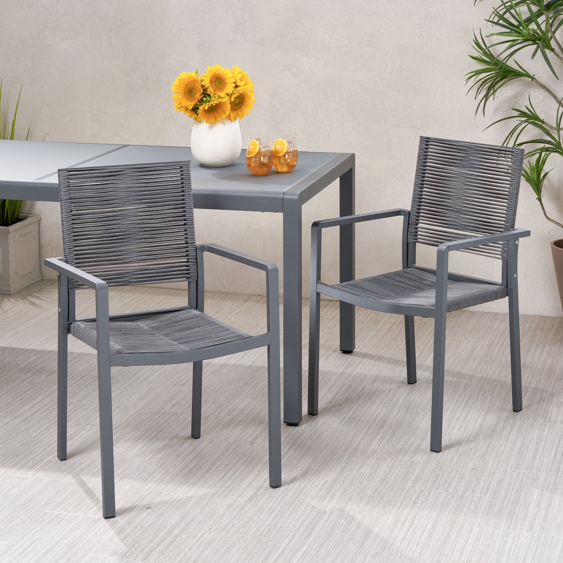 Gray metal outdoor chair with woven rope seat and back modern design
