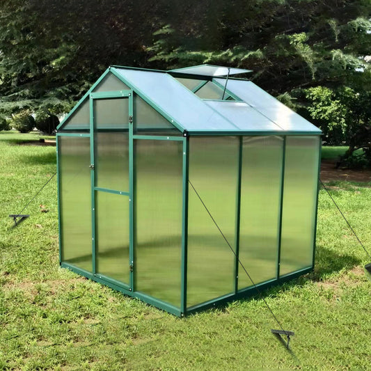 Green polycarbonate greenhouse with aluminum frame ideal for backyard gardening