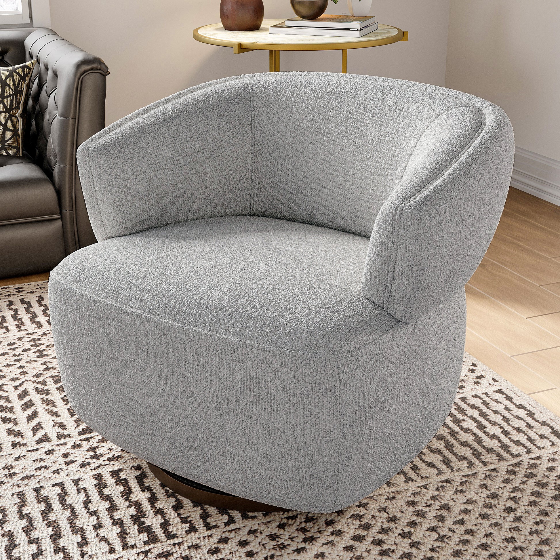Grey boucl swivel armchair with curved back on a patterned rug