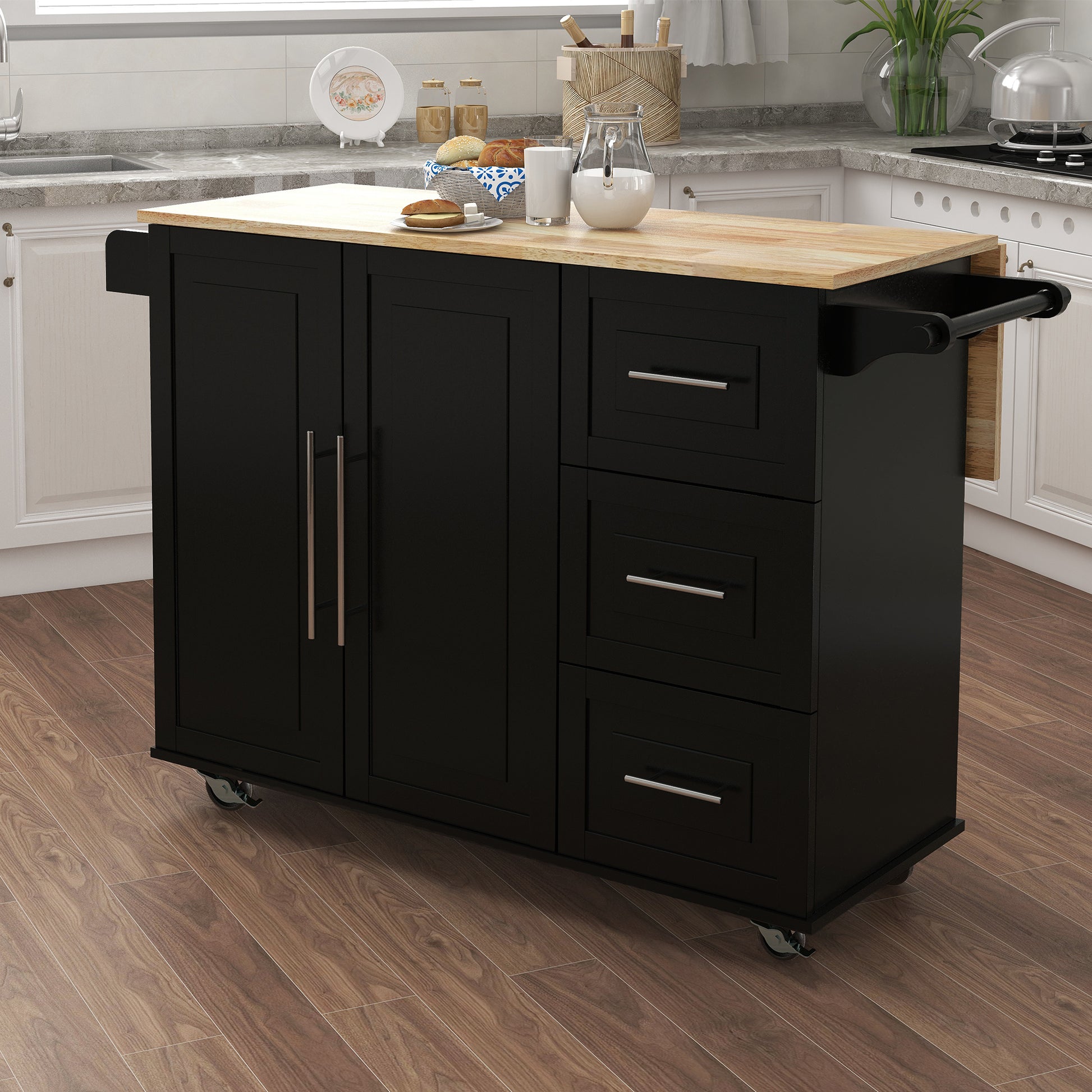 Black kitchen island with butcher block top and silver hardware