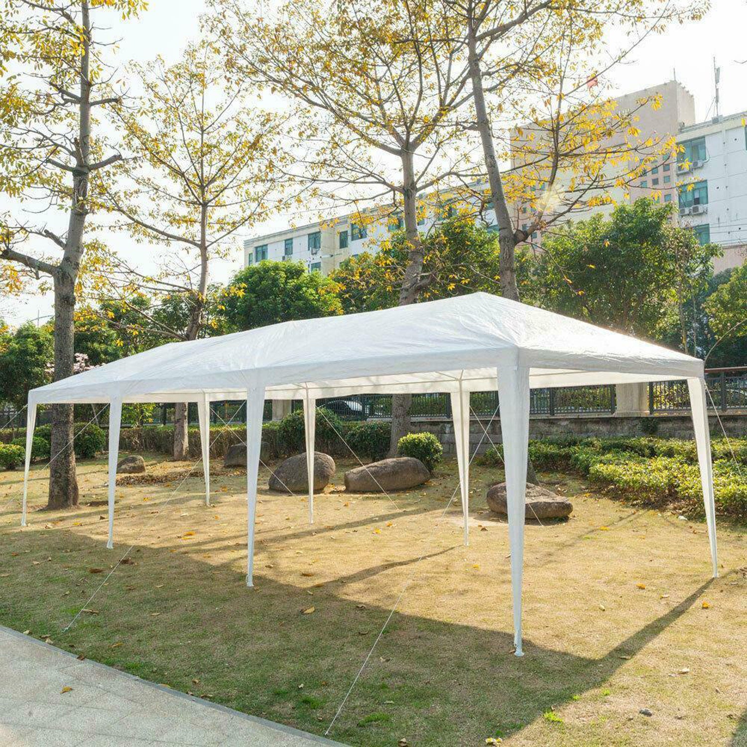 White x ft party tent set up on a grassy lawn for outdoor events