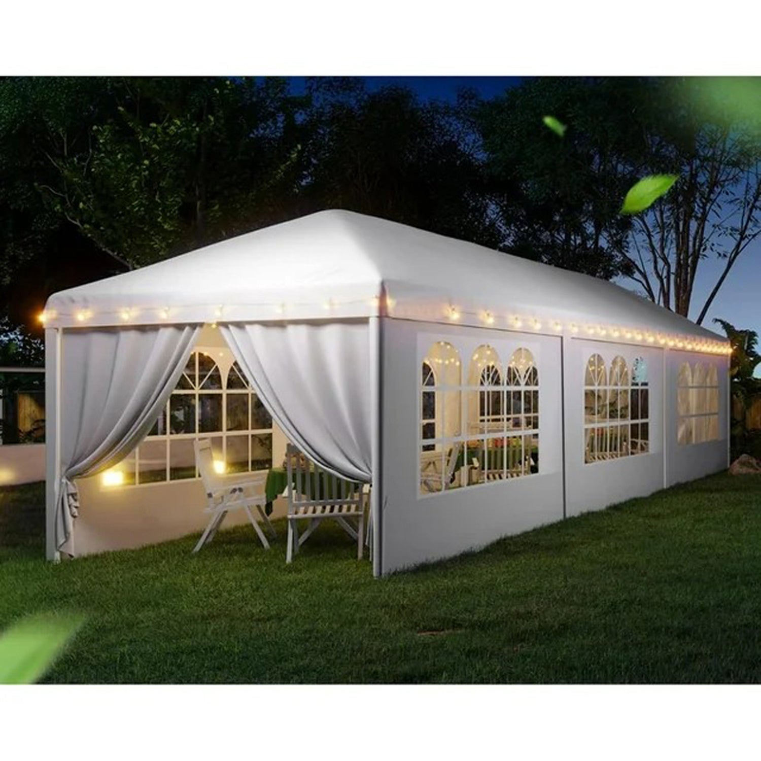 White event tent with arched windows and string lights perfect for outdoor parties