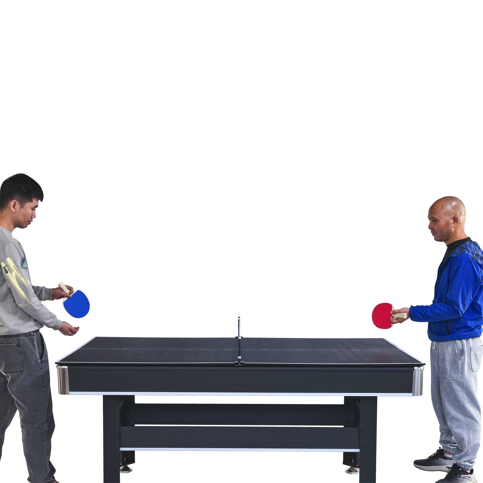 Two men playing table tennis with red and blue paddles on a black table