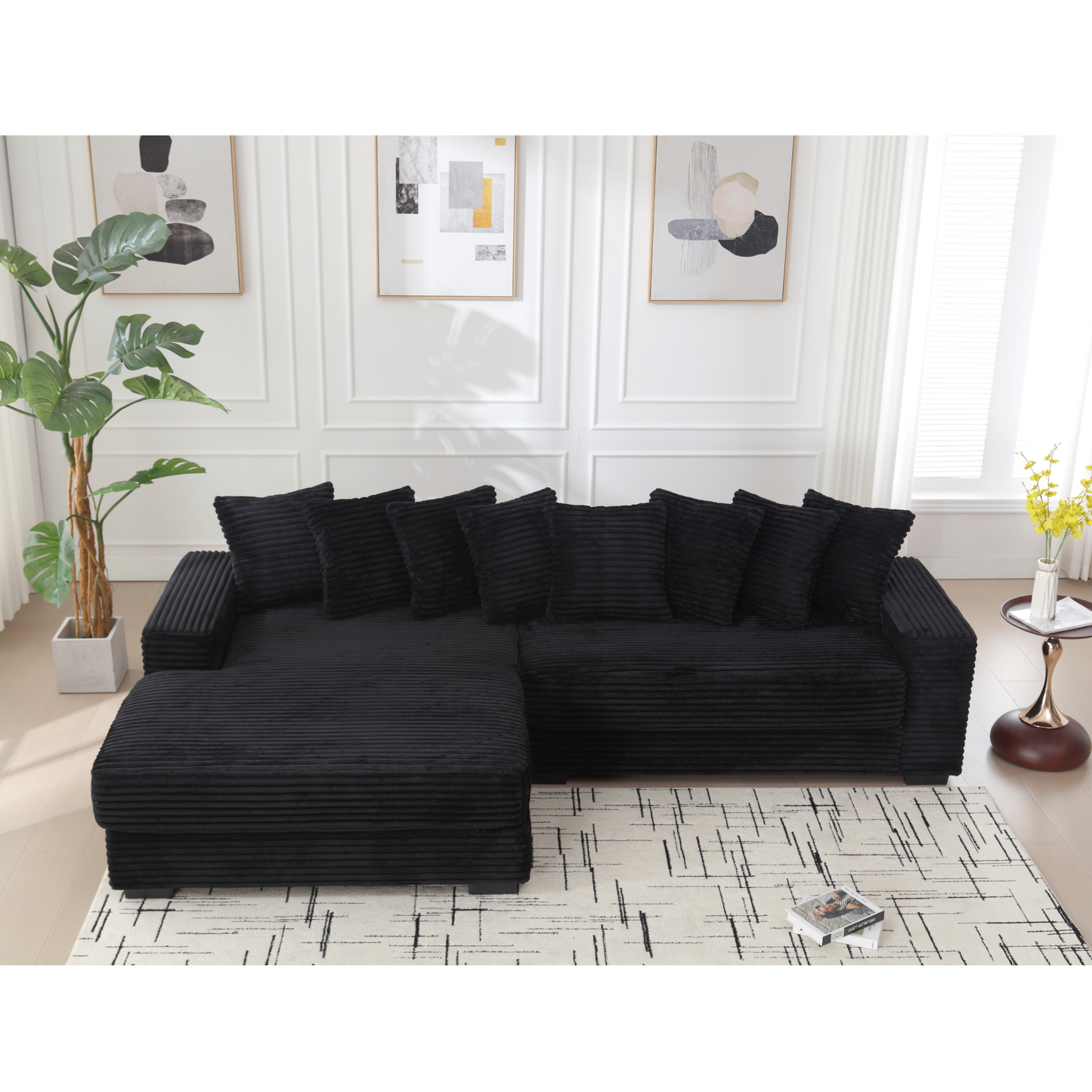 Black corduroy sectional sofa with plush accent pillows modern living room furniture