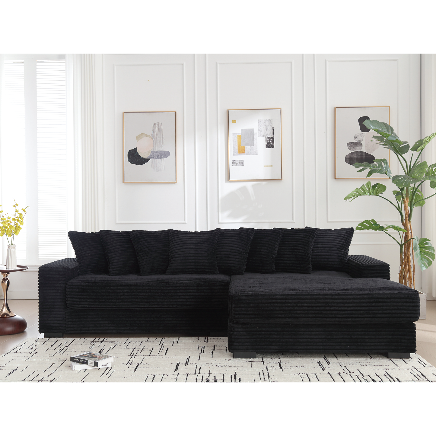 Plush black corduroy sectional sofa with five deep cushions perfect for living room comfort