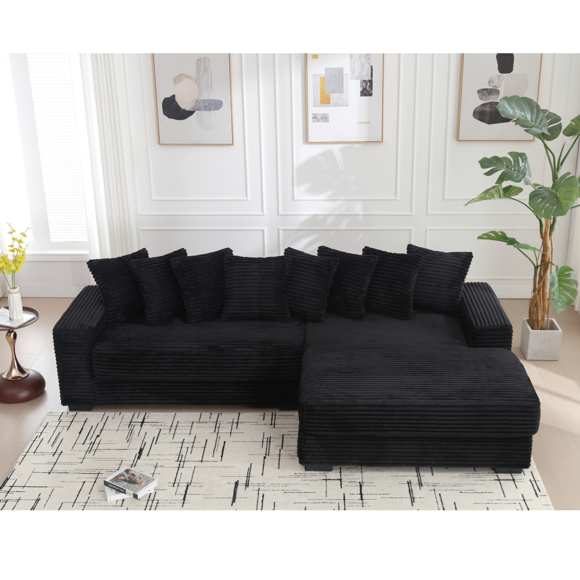 Black corduroy sectional sofa with plush cushions and ottoman modern living room seating