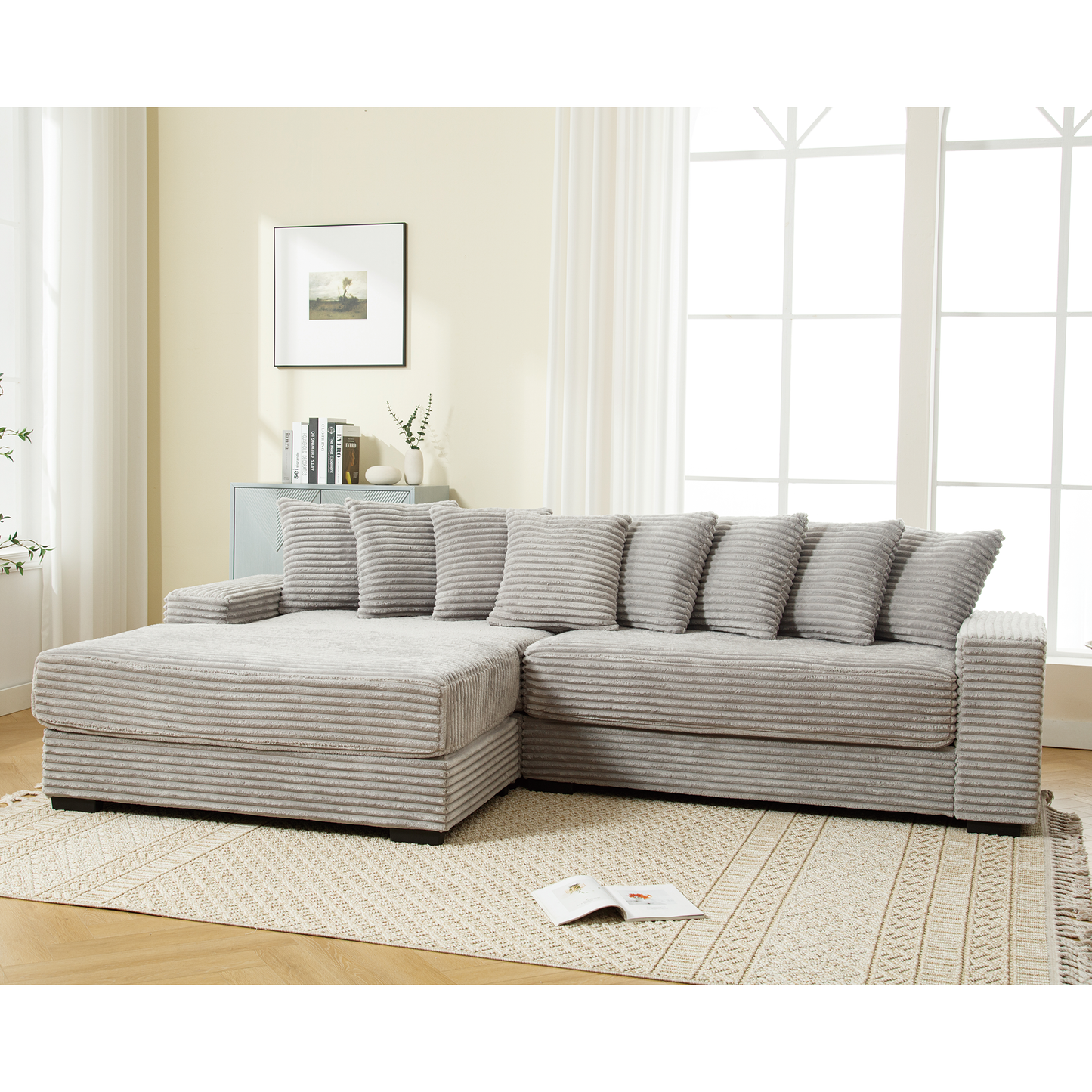Light grey corduroy sectional sofa with plush throw pillows ideal for living room comfort