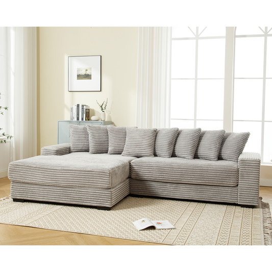Light grey corduroy sectional sofa with plush throw pillows ideal for living room comfort