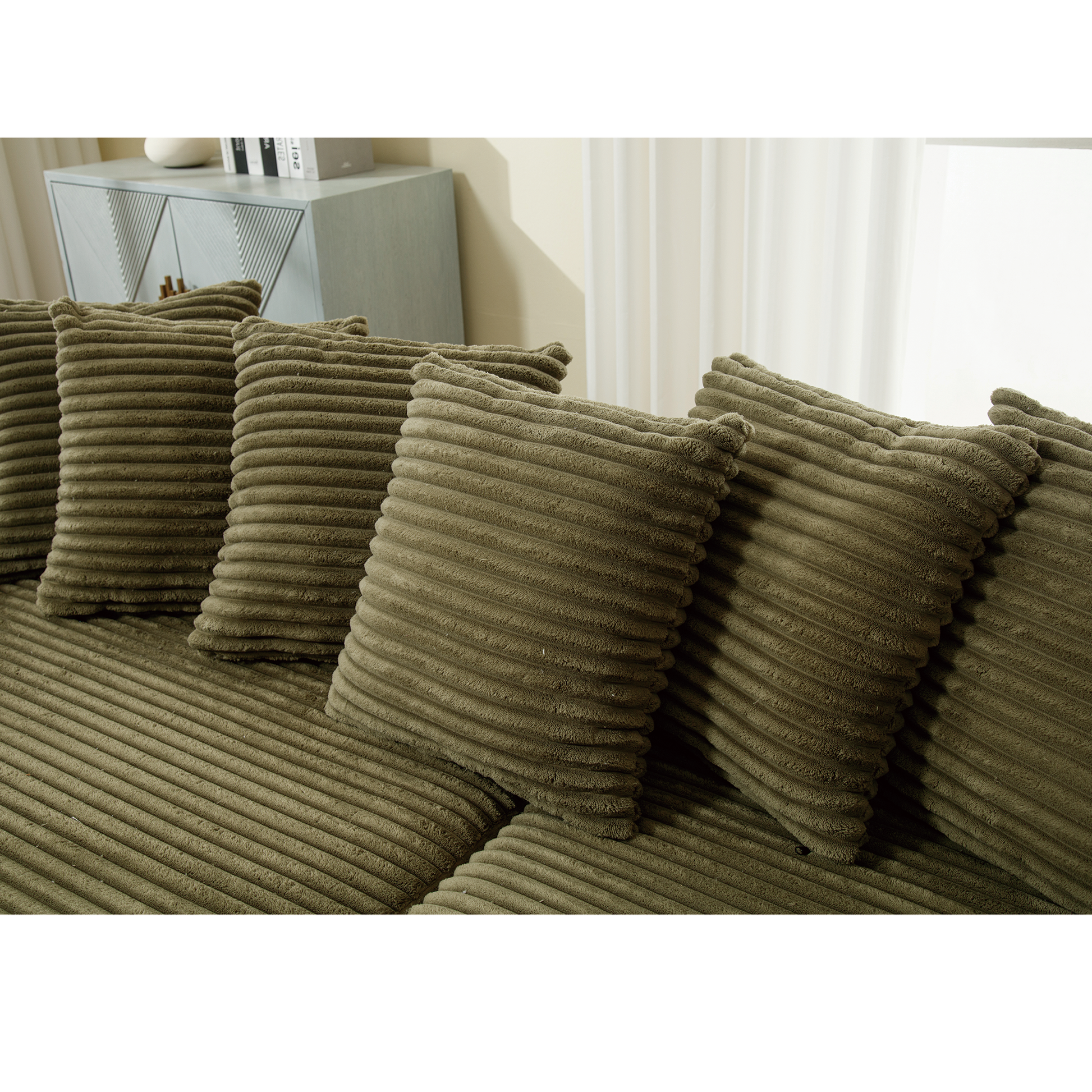 Olive green corduroy sofa cushions with ribbed texture for plush comfort