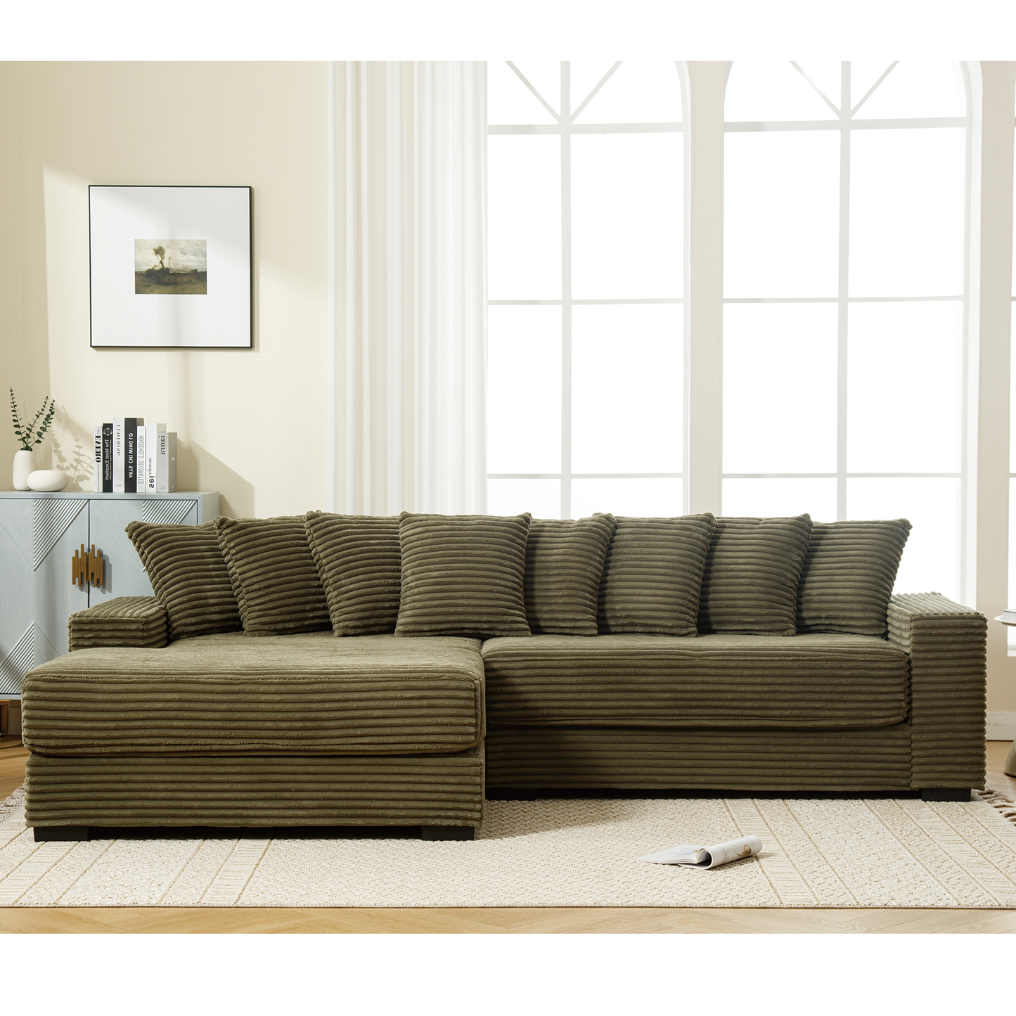 Khaki corduroy sectional sofa with plush throw pillows in a modern living room