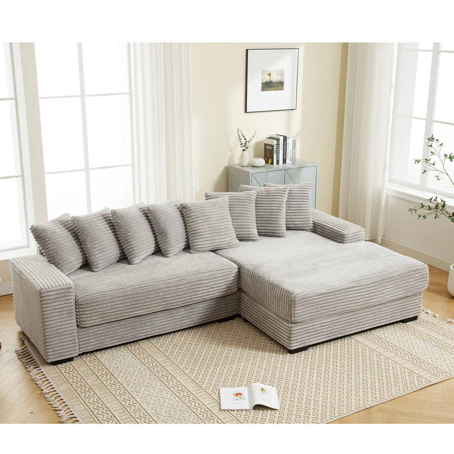Light gray corduroy sectional sofa with multiple throw pillows perfect for modern living rooms