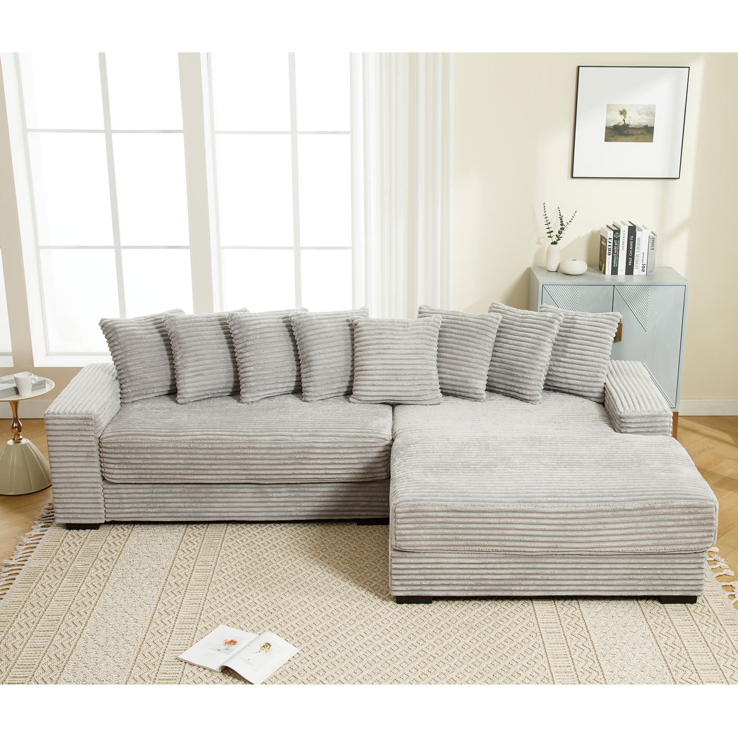 Soft grey corduroy sectional sofa with plush throw pillows perfect for modern living rooms