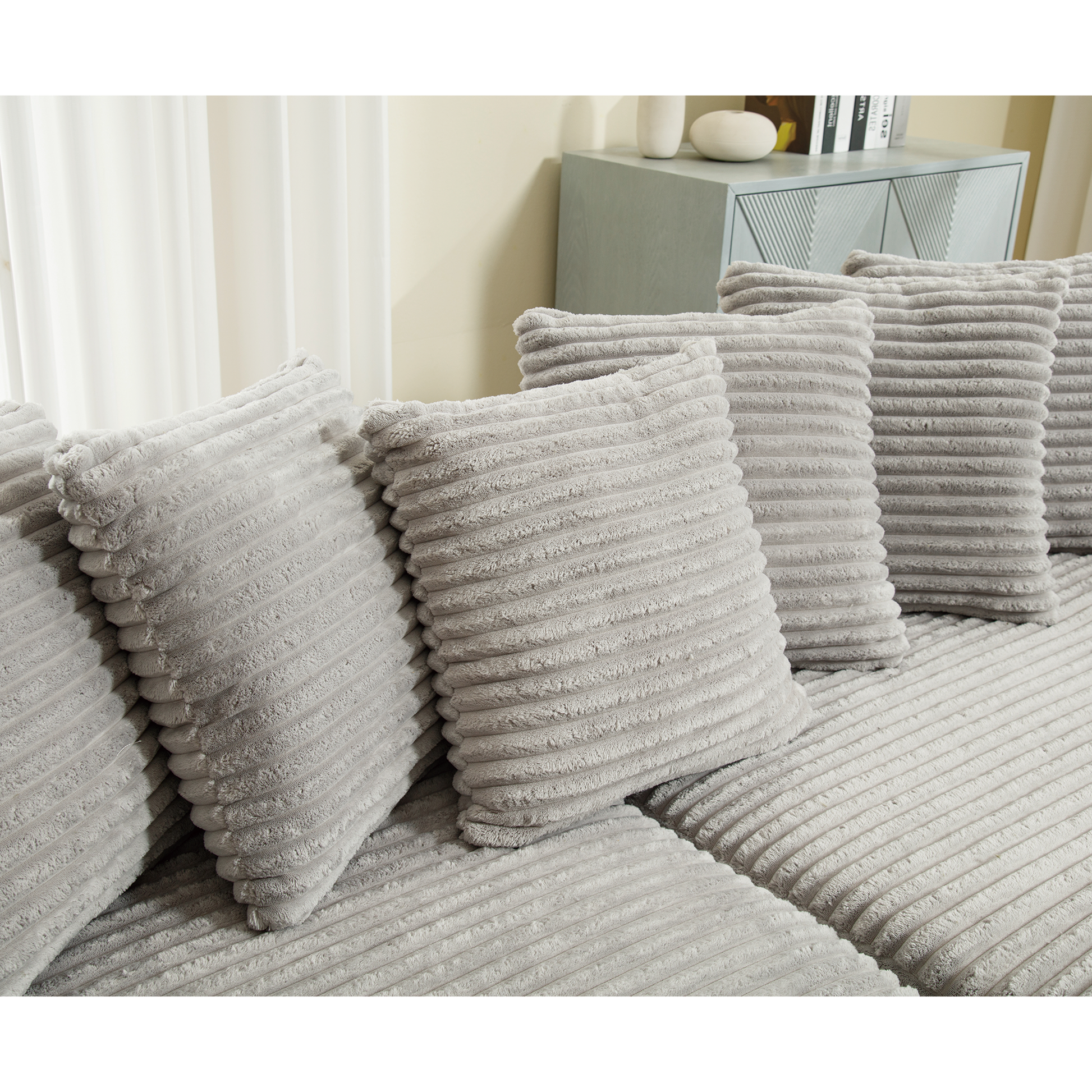 Plush grey corduroy sofa cushion with thick ribbed texture for ultimate comfort