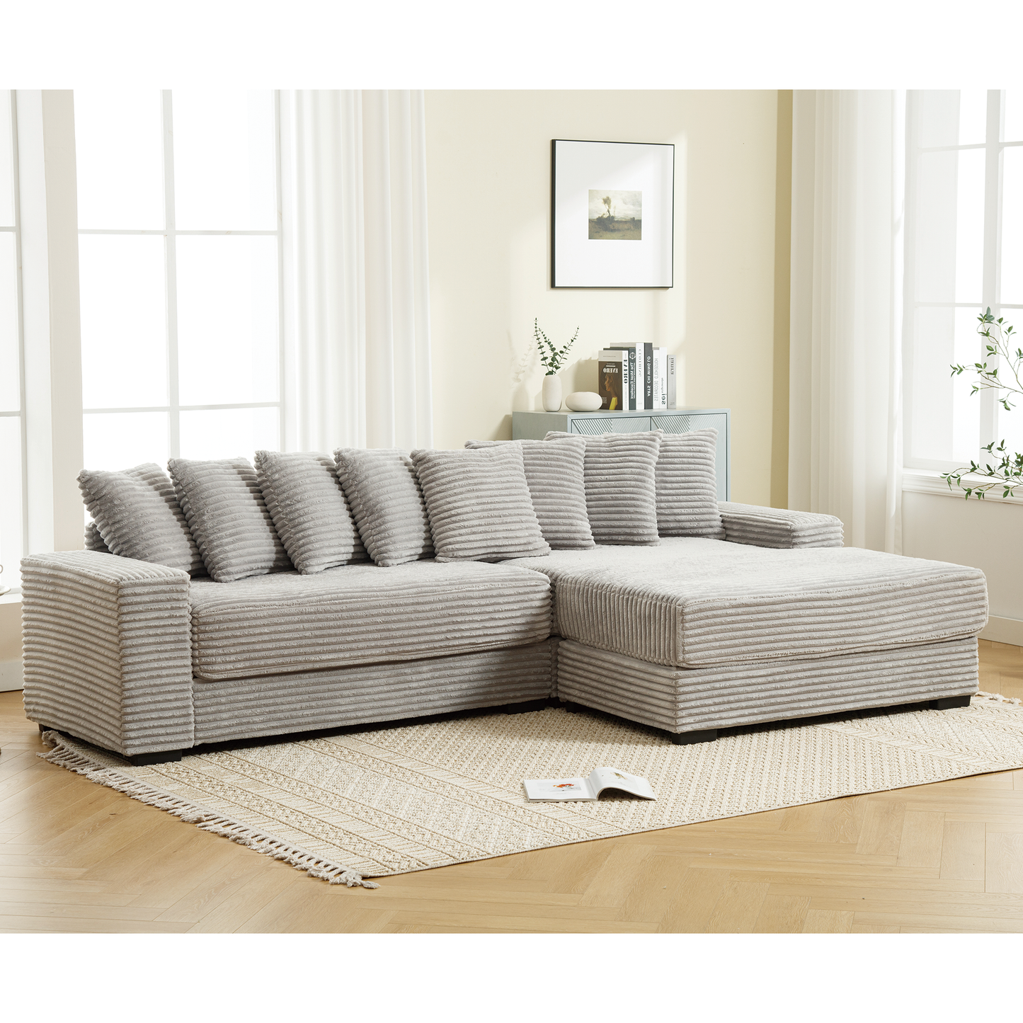 Light grey corduroy sectional sofa with plush throw pillows for a cozy living room