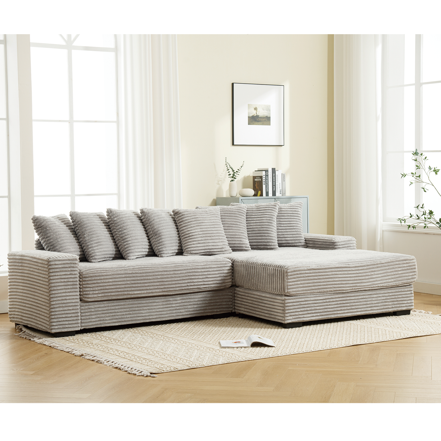 Soft corduroy sectional sofa in light grey with plush throw pillows for ultimate comfort