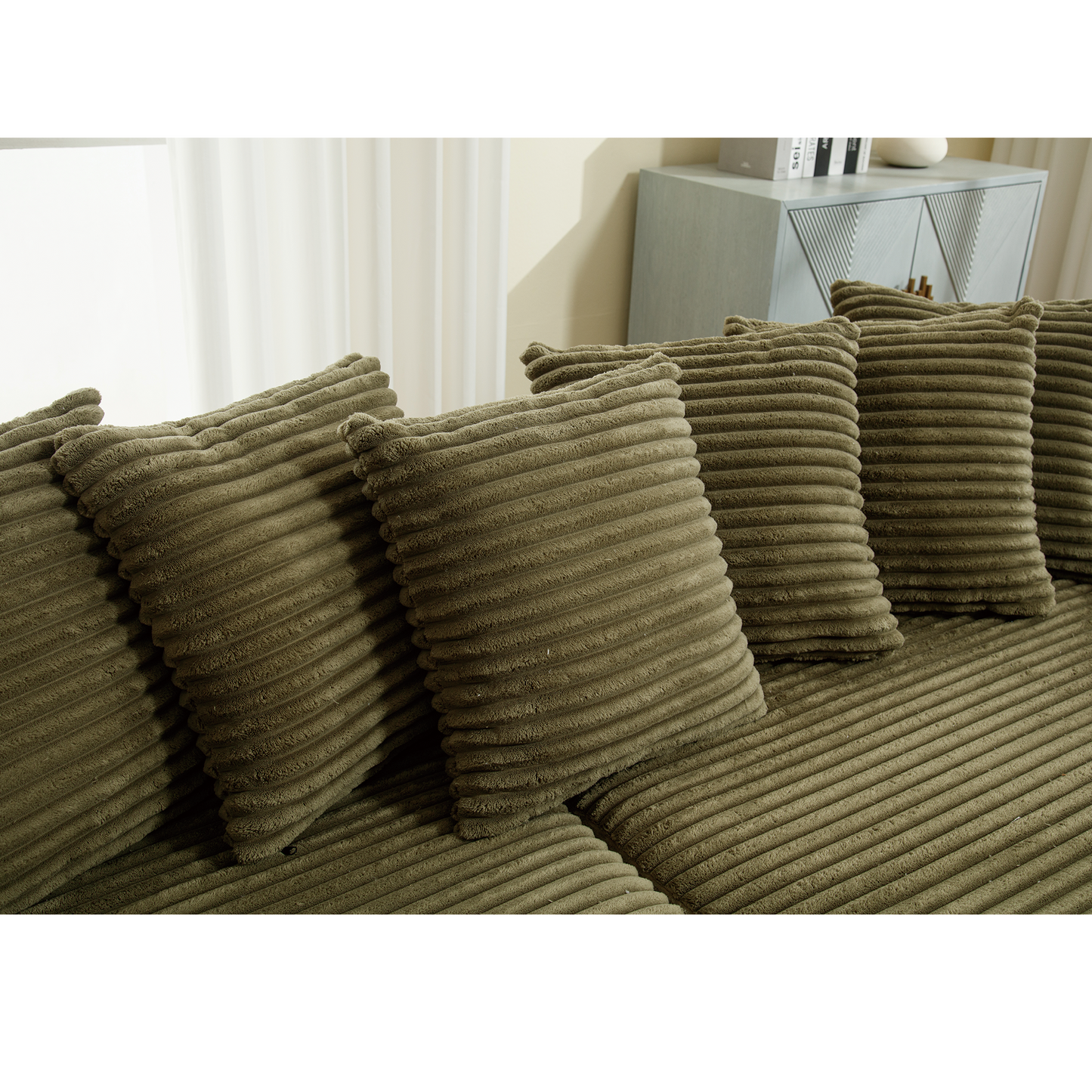 Olive green corduroy couch cushions with subtle ribbed texture