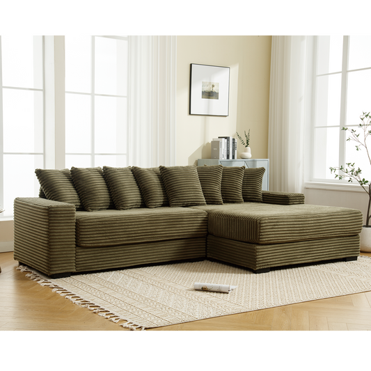 Olive green corduroy sectional sofa with multiple plush pillows for a modern living room