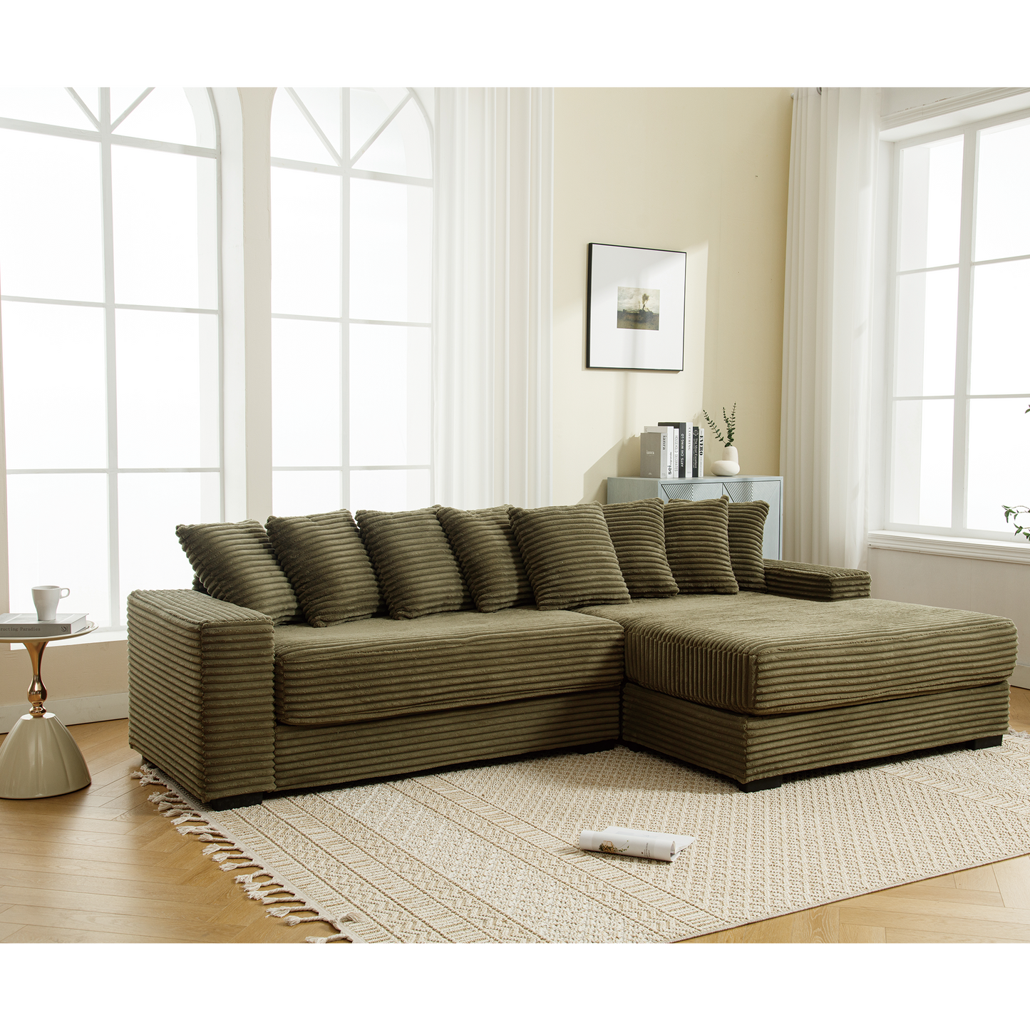 Olive green corduroy sectional sofa with plush cushions and ottoman