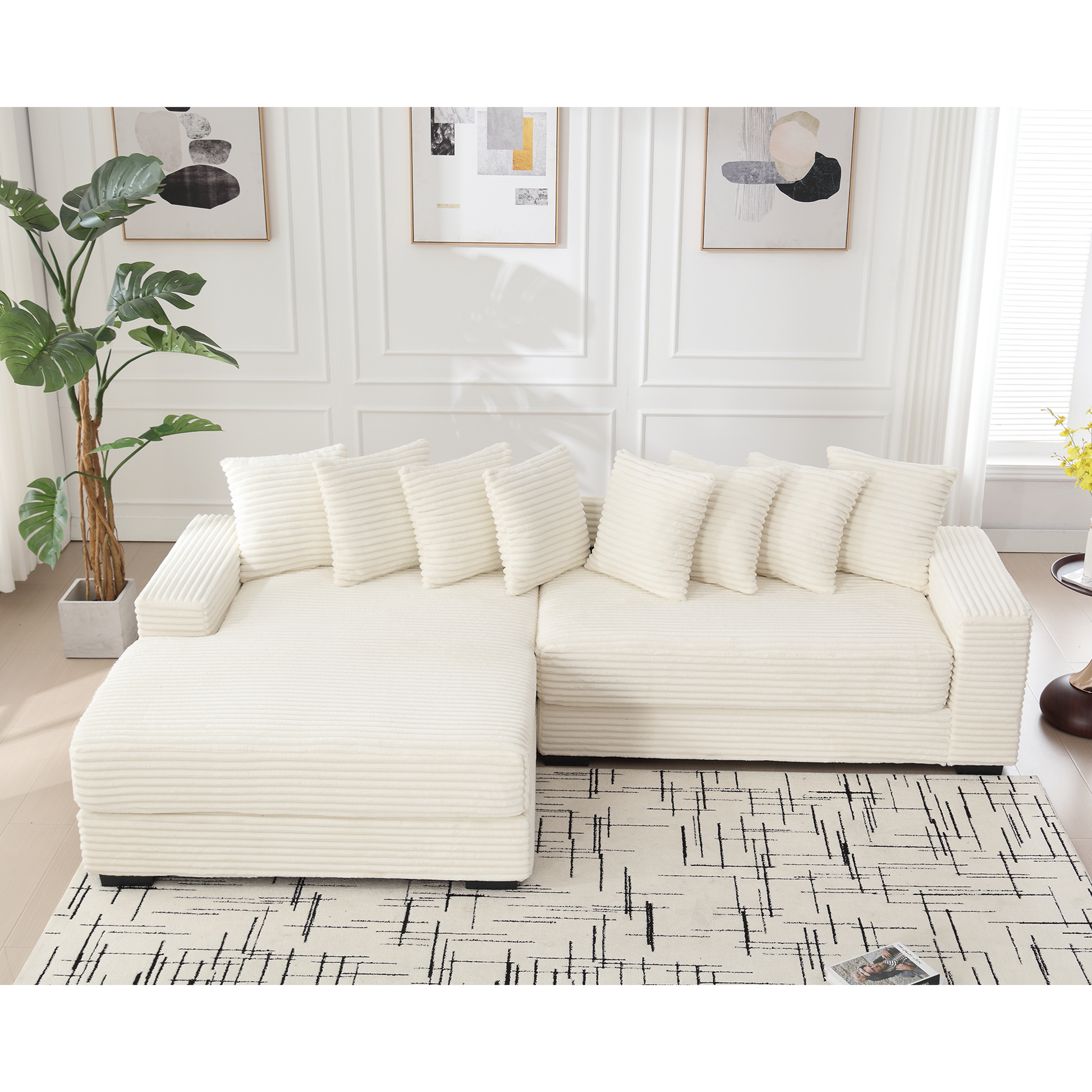 Plush cream corduroy sectional sofa with multiple throw pillows for a cozy living room setup