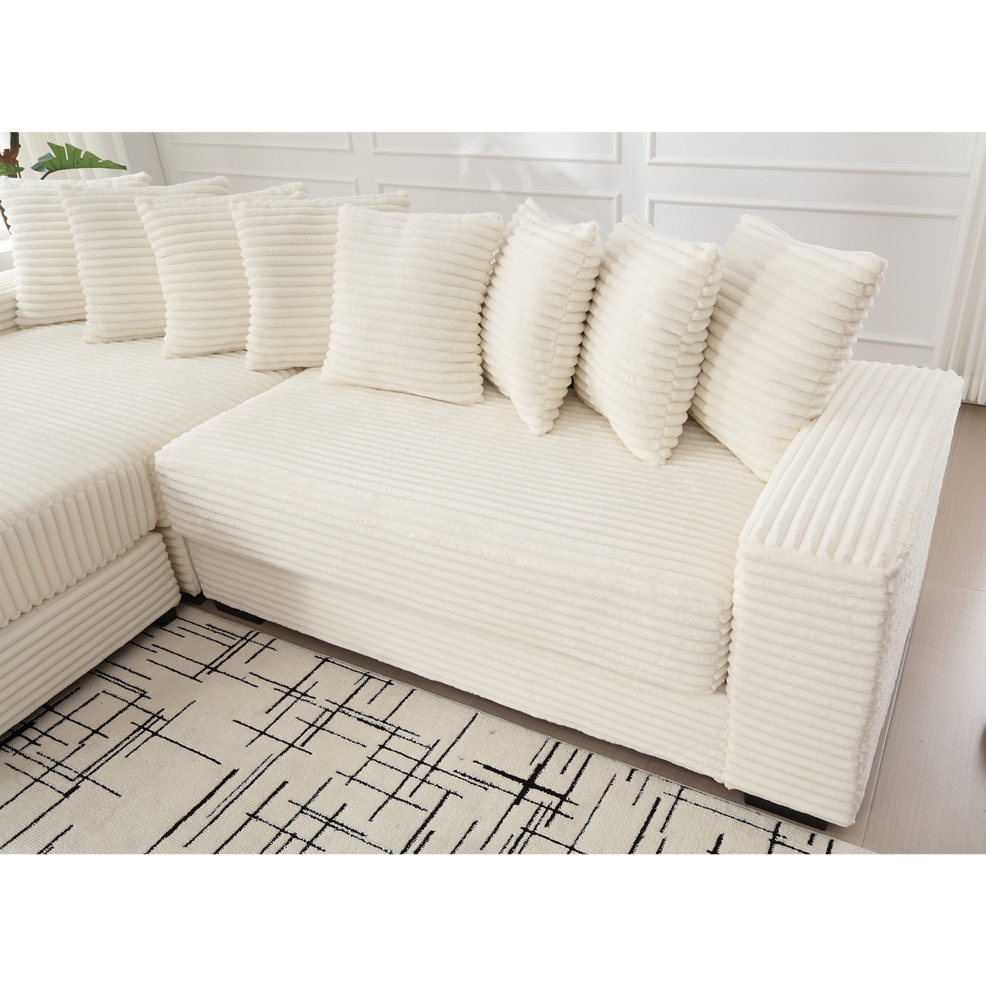 Cream corduroy sectional sofa with plush throw pillows for a cozy living room