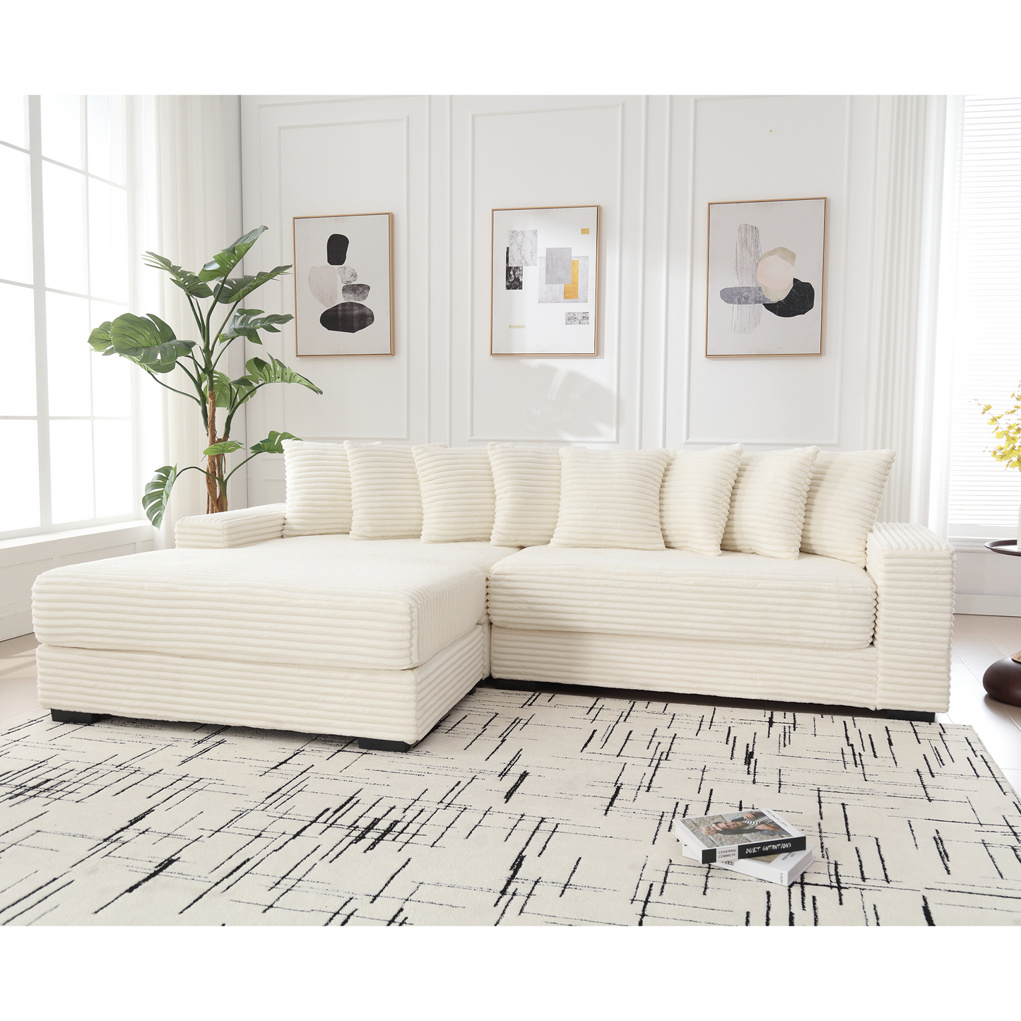 Cream corduroy sectional sofa with plush cushions and modern abstract art in background